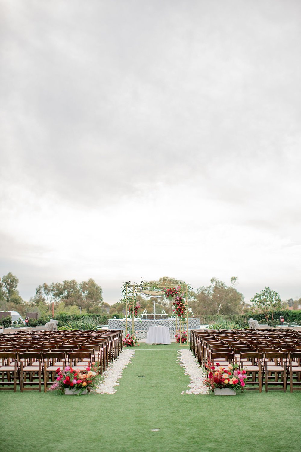 red and fuchsia ceremony flowers.jpg