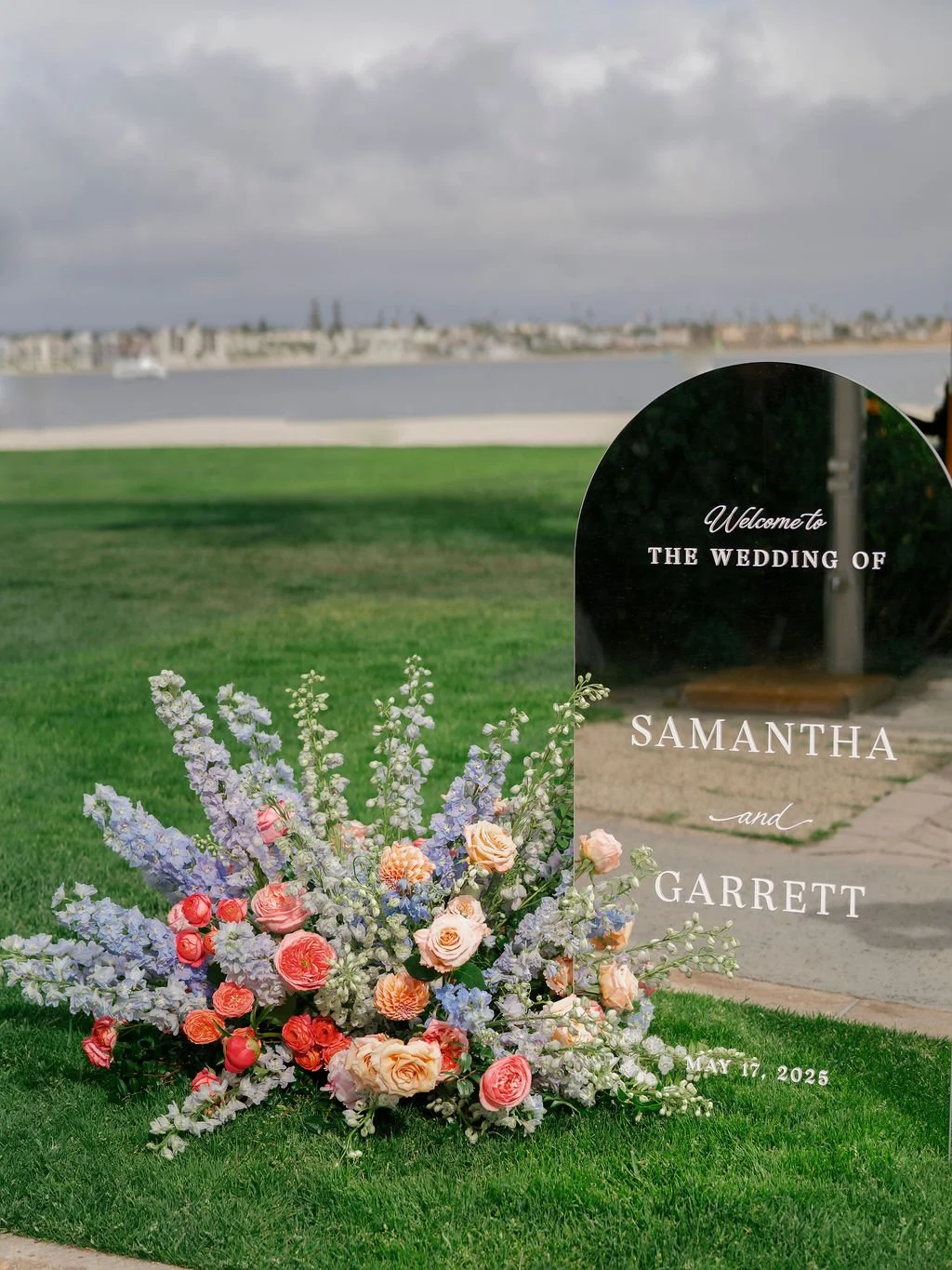 blue and pink welcome sign flowers.jpg
