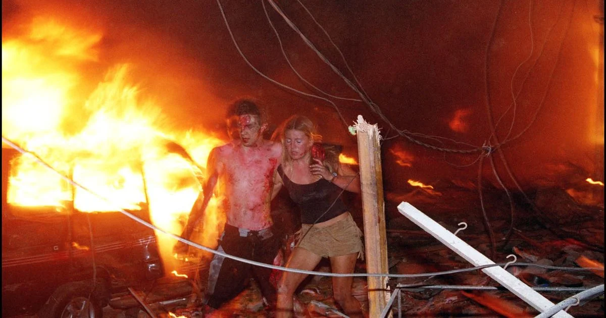 Hanabeth Luke assisting Tom Singer, who later died of his injuries