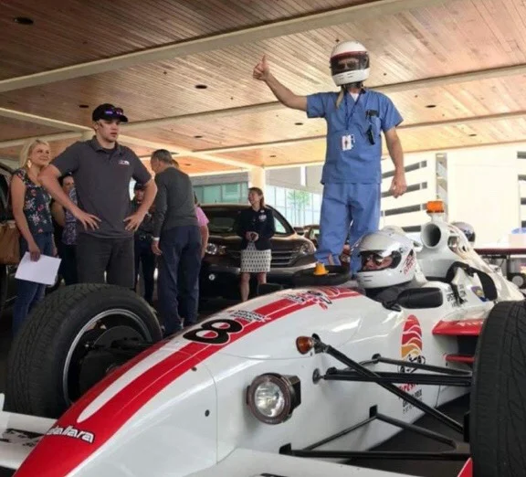 Liam working at the Indy Car Experience!