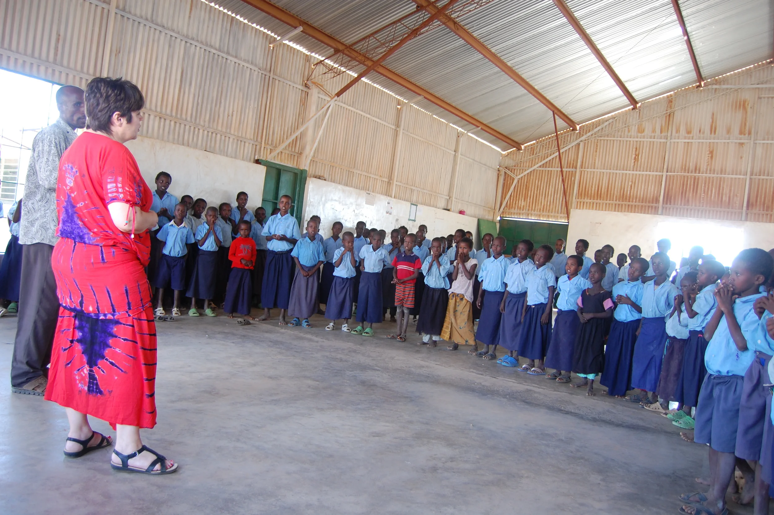 Nancy encouraging the students to value their education, work hard, and look to their teachers as mentors. 