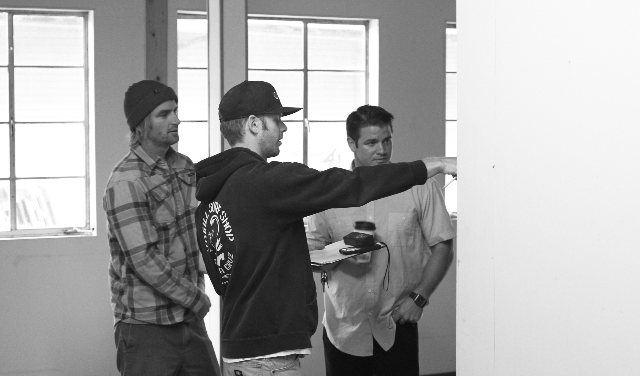 Nick Pavlina, Scott Pavlina and Ryan Grable making sketches of potential floor plans in downtown Soquel