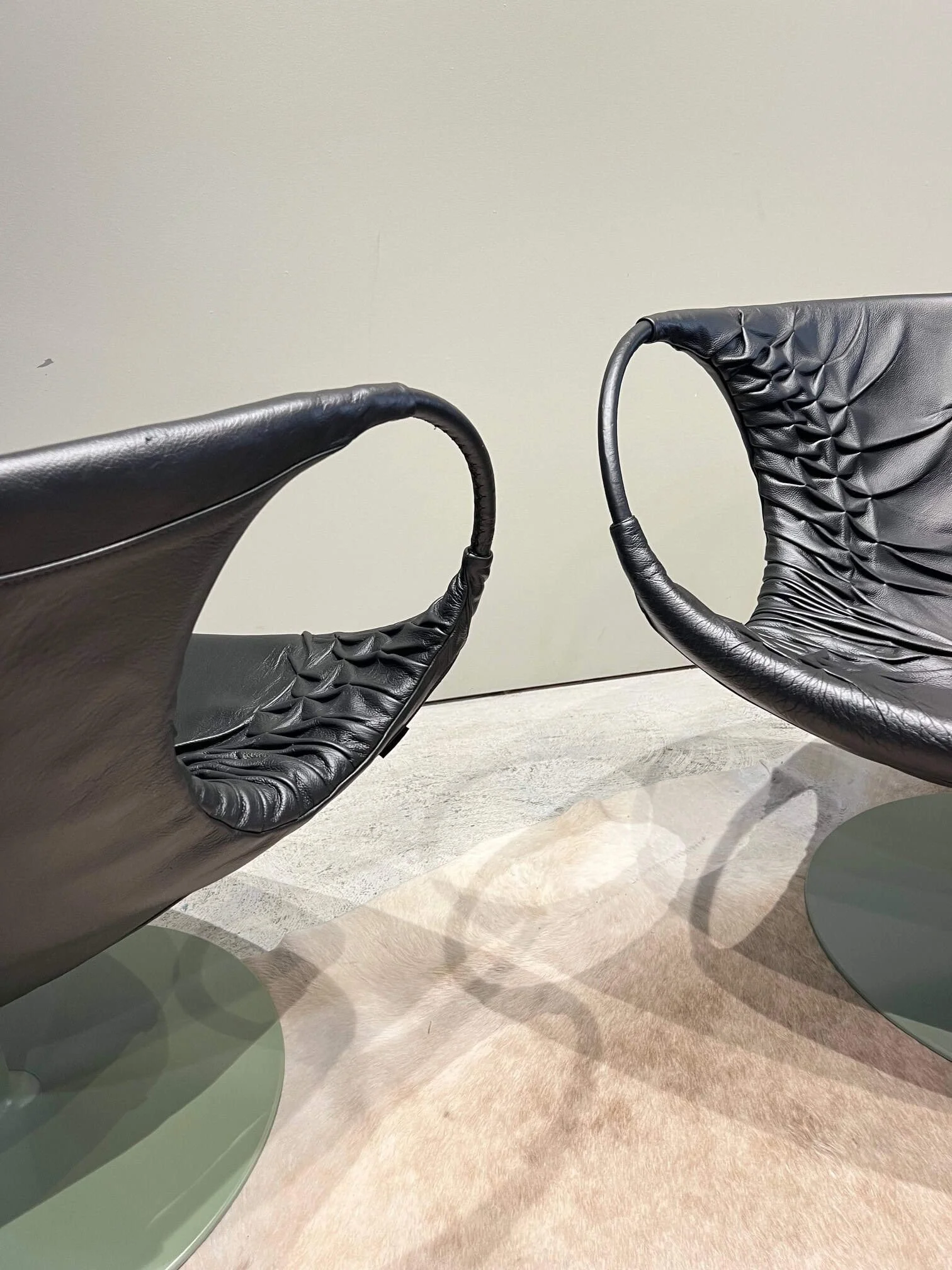 pair of black leather mid century modern italian lounge chairs.jpg