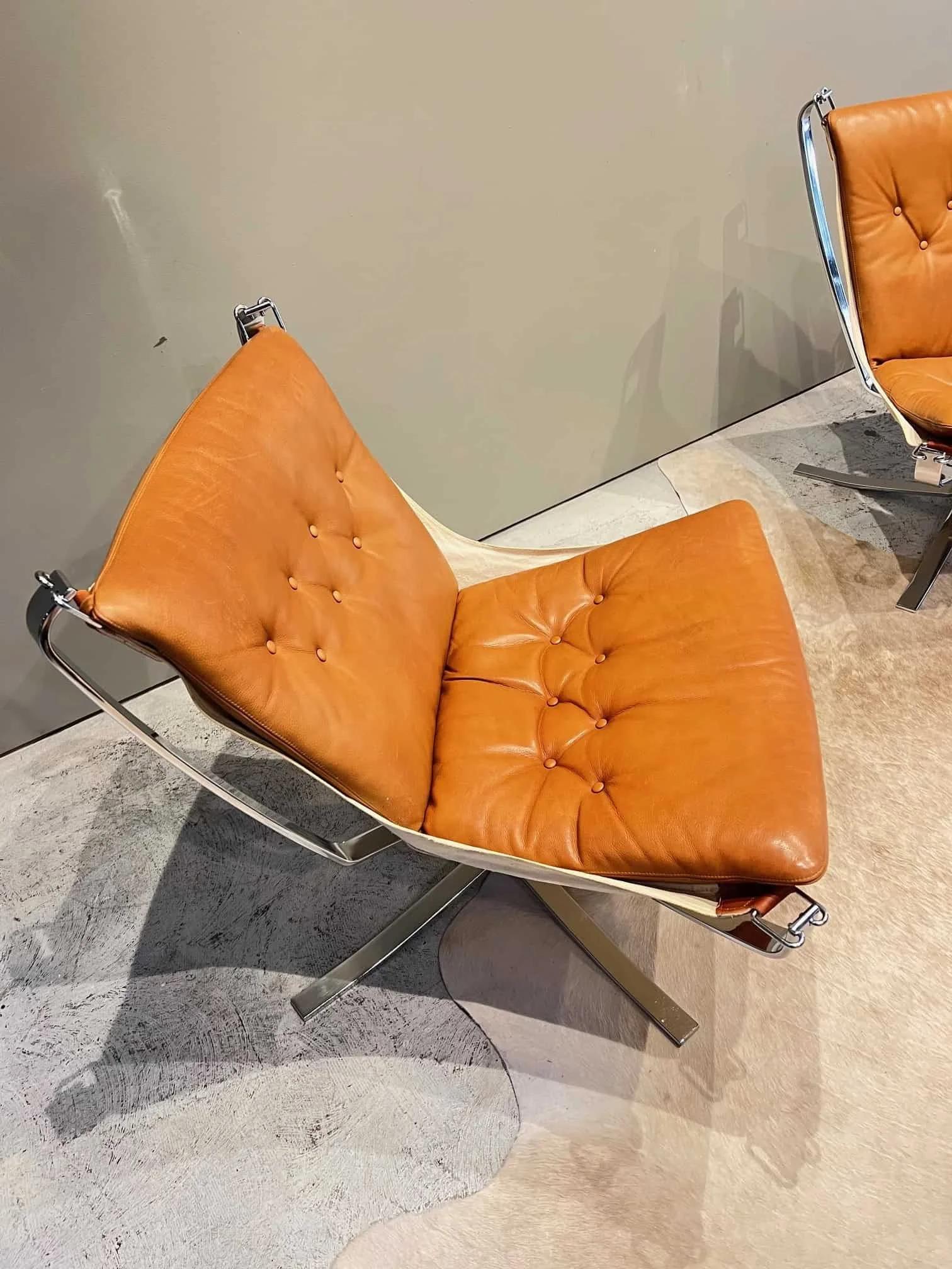 cognac leather and chrome falcon chair.jpeg