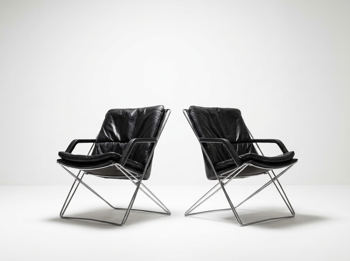 vintage black leather and chrome danish lounge chairs