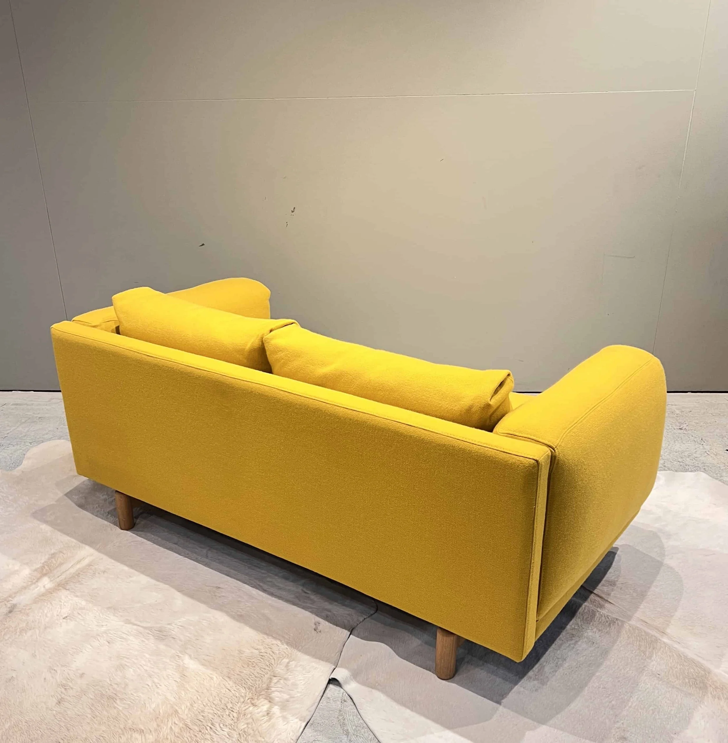 muuto-rest-2-seat-sofa-yellow-fabric-side-view-13.jpg