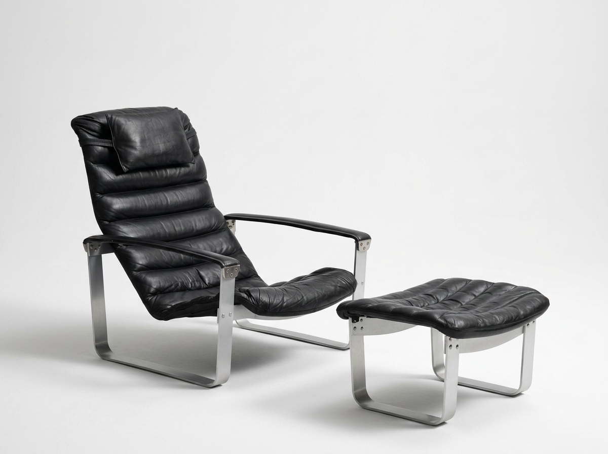 Vintage Danish chrome and black leather lounge chair with footstool
