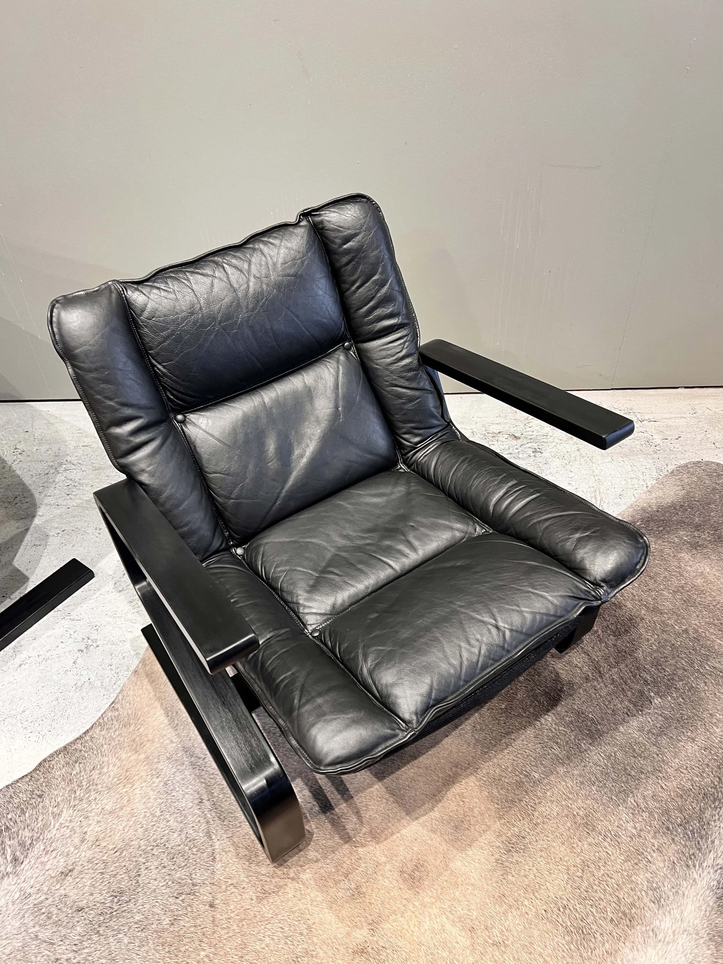 danish-leather-lounge-chair-black-cushions-front-view.jpg