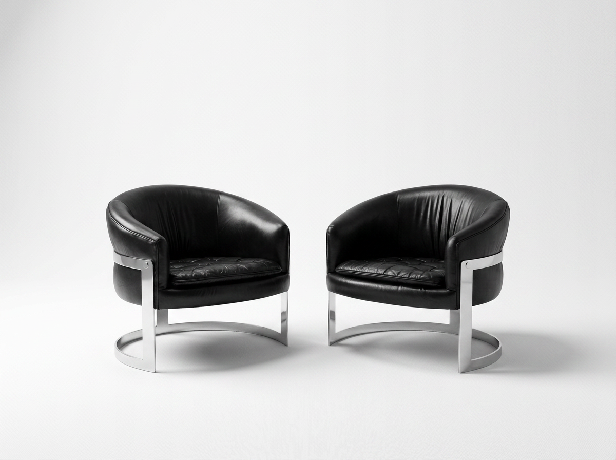 vintage black leather and chrome lounge chairs by Milo Baughman