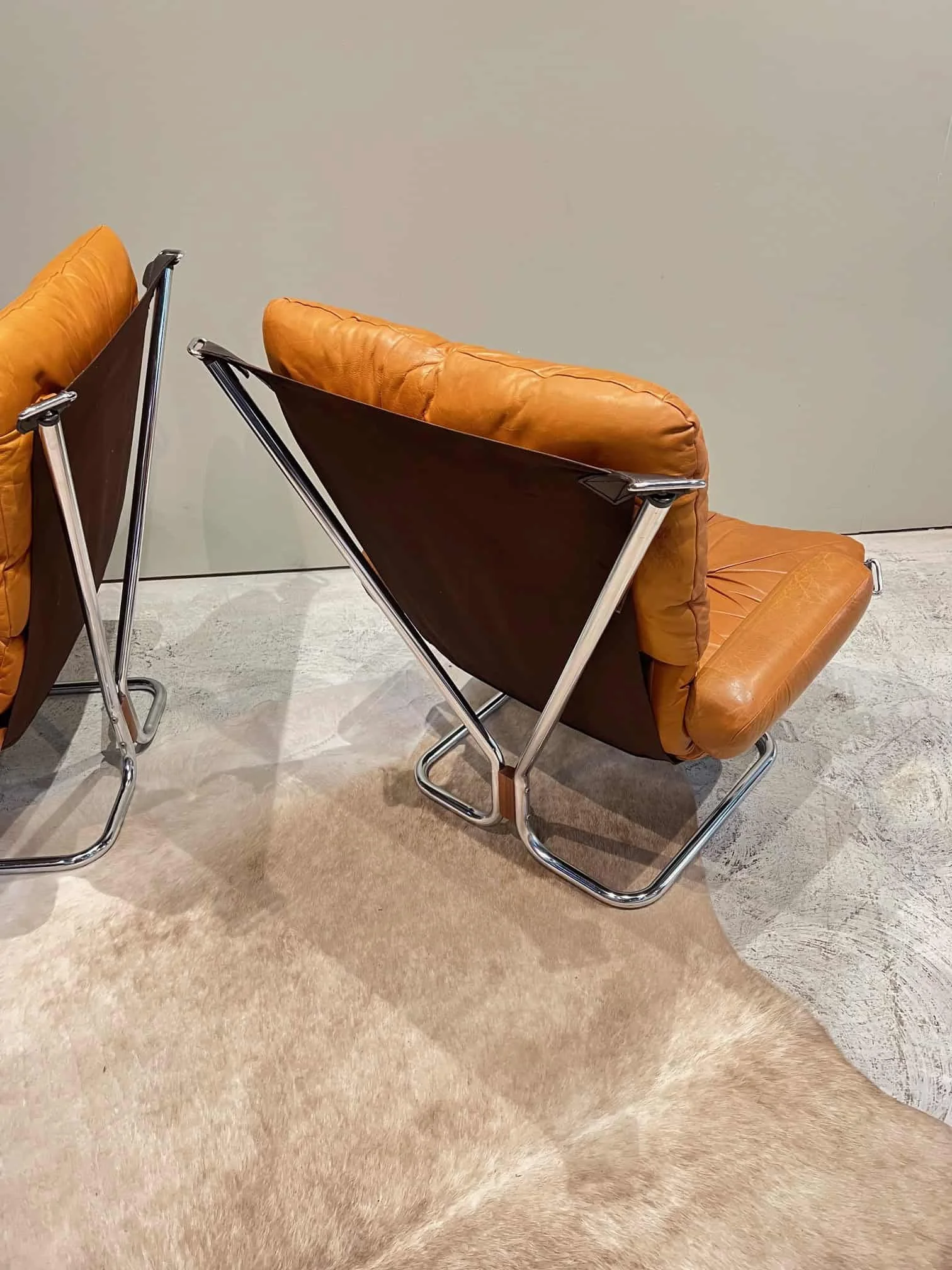 chrome and leather mid century modern lounge chairs.jpeg