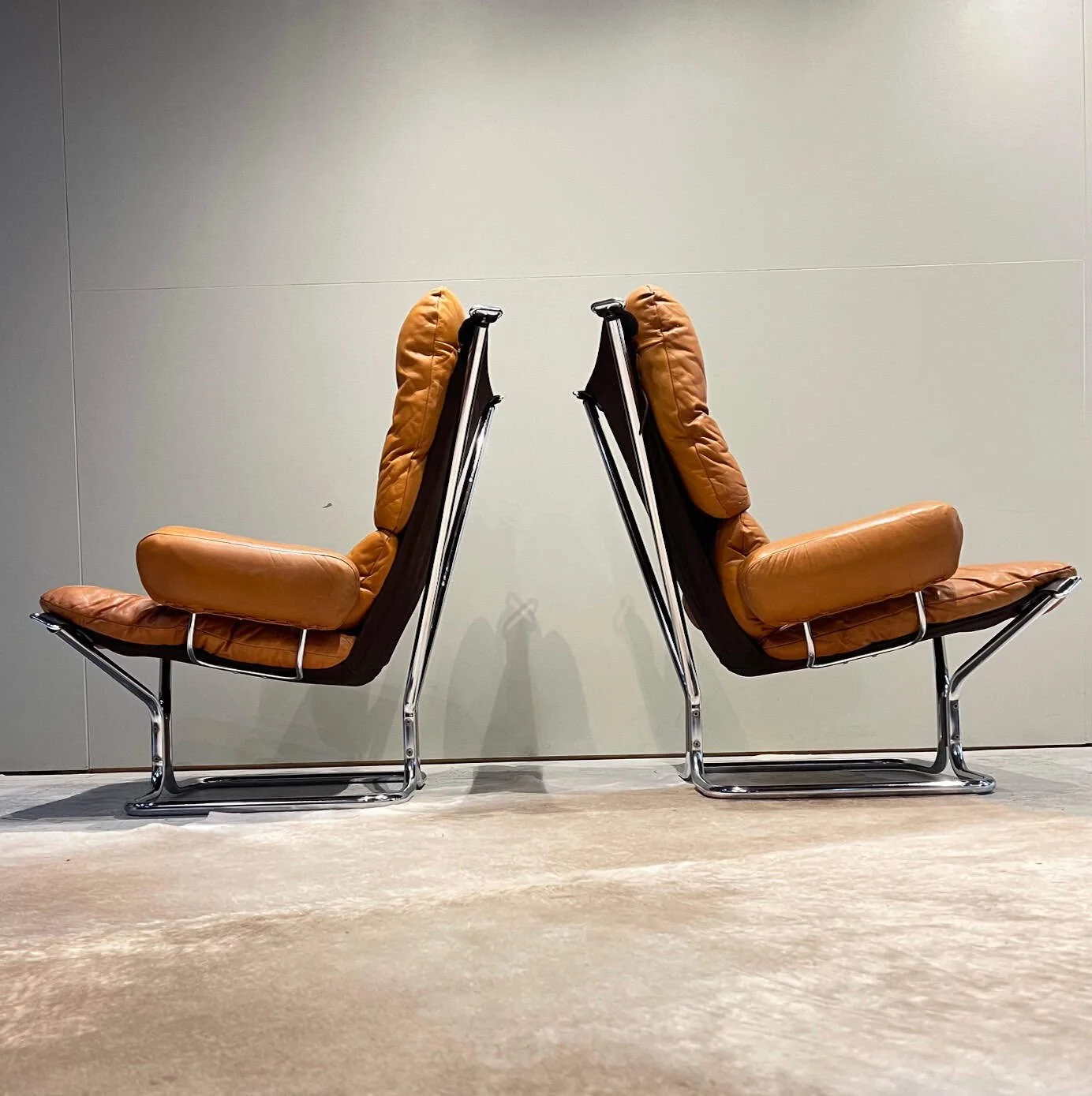 chrome and leather high back armchairs with armrests.jpeg