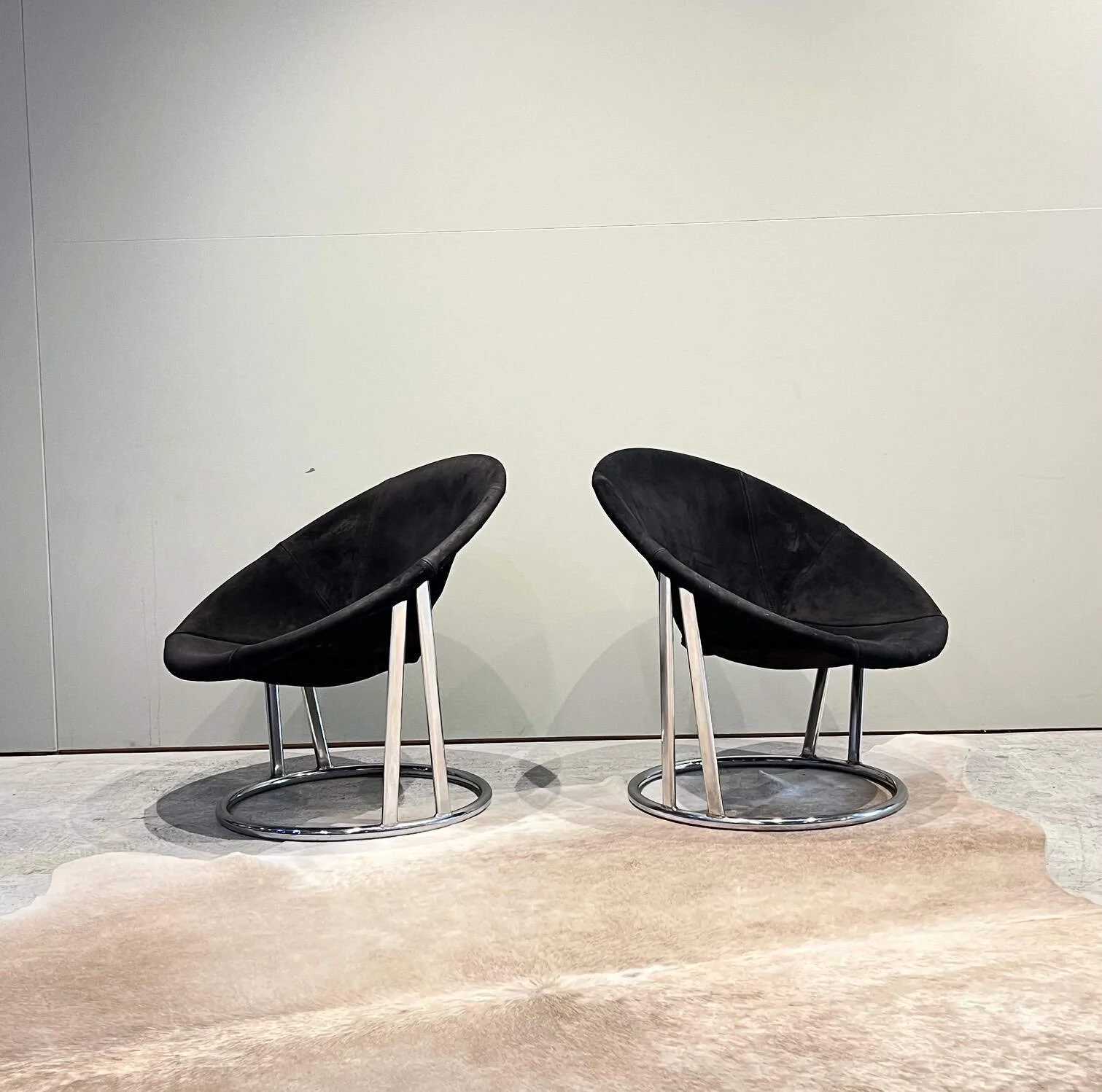 pair of 70s chrome and leather lounge chairs.jpg