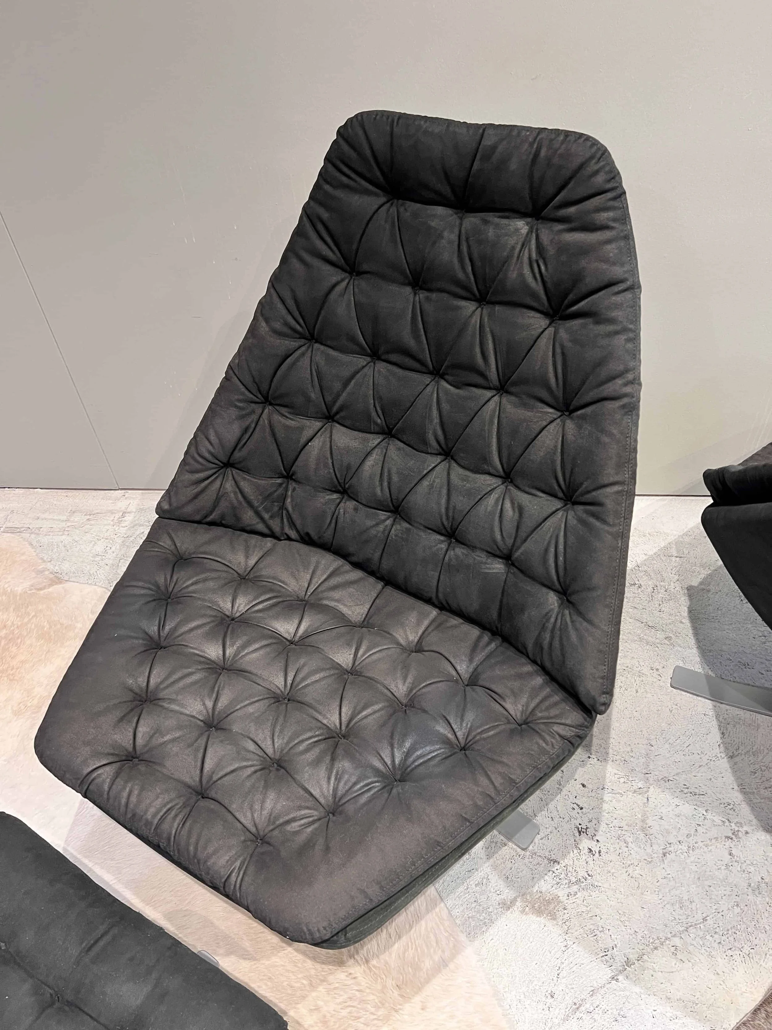 black-tufted-swivel-lounge-chair-seat-and-back.jpg