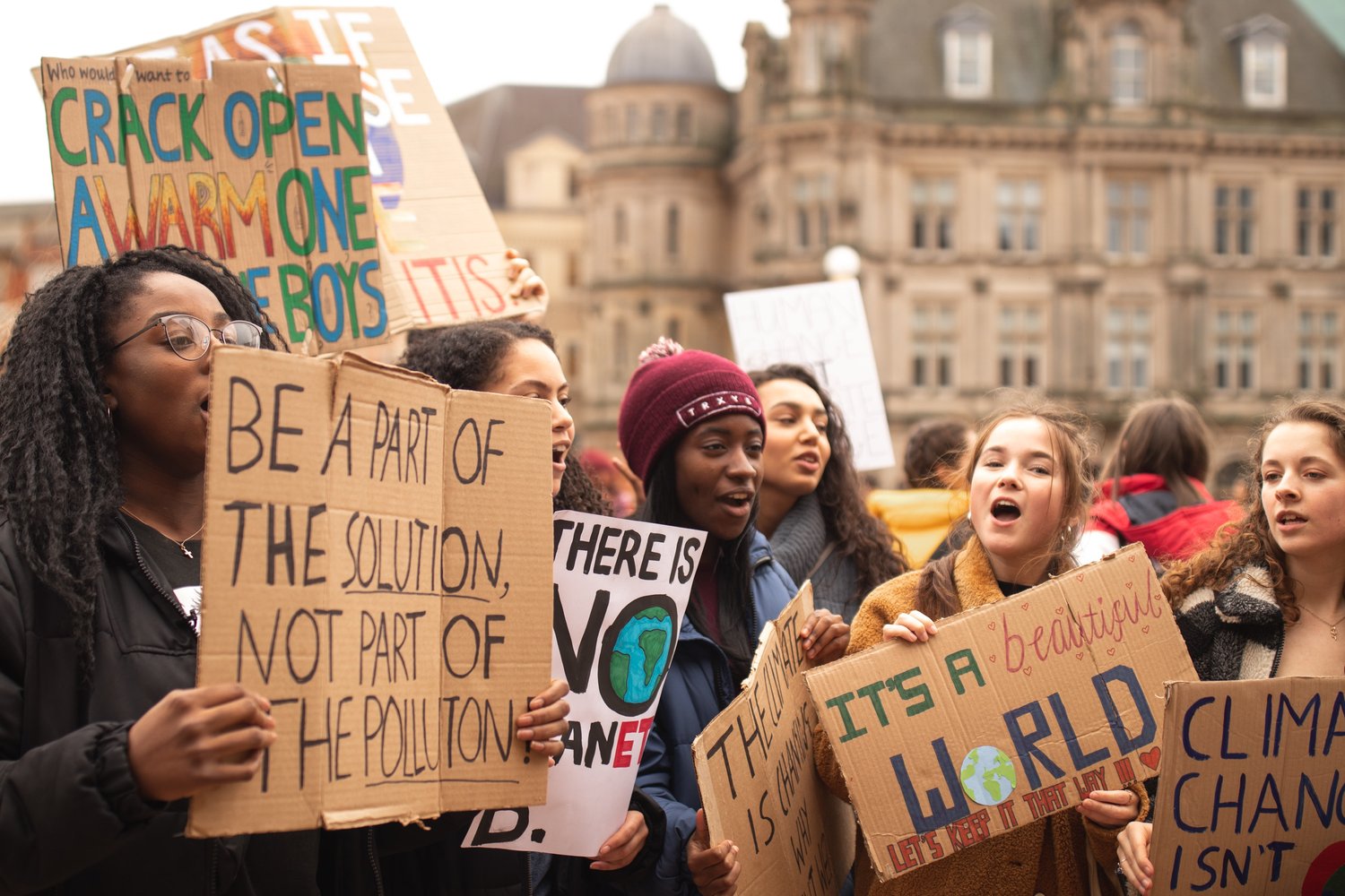 group of young people protesting with signs
