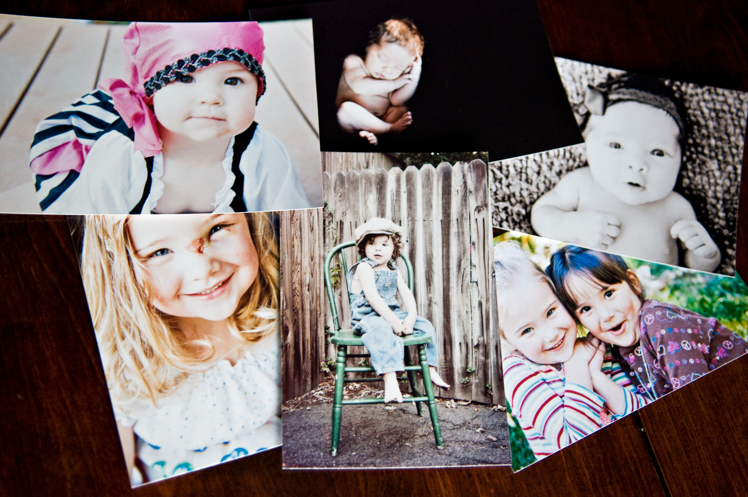pile of printed photographs taken by Kim Rodgers Photographer in Denver Colorado