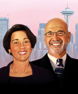 A smiling woman and man in professional attire standing in front of a city skyline with the Space Needle in the background.