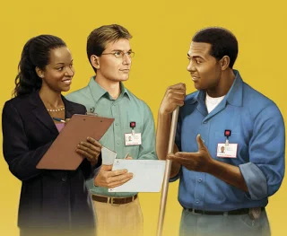 Three healthcare professionals engaging in a discussion against a yellow background, with one holding a clipboard and another holding a notepad.