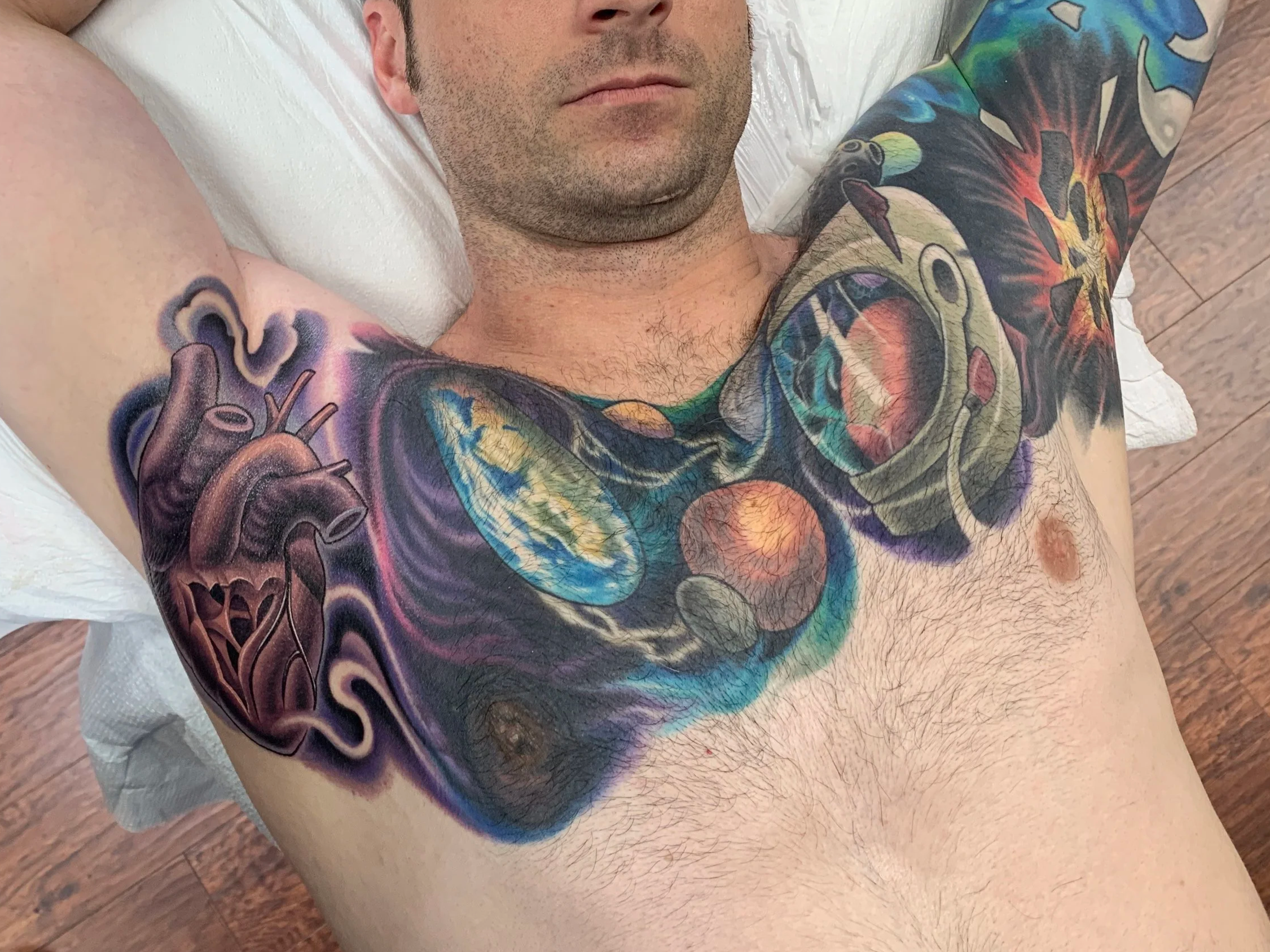 Chest and arm pits tattoo
