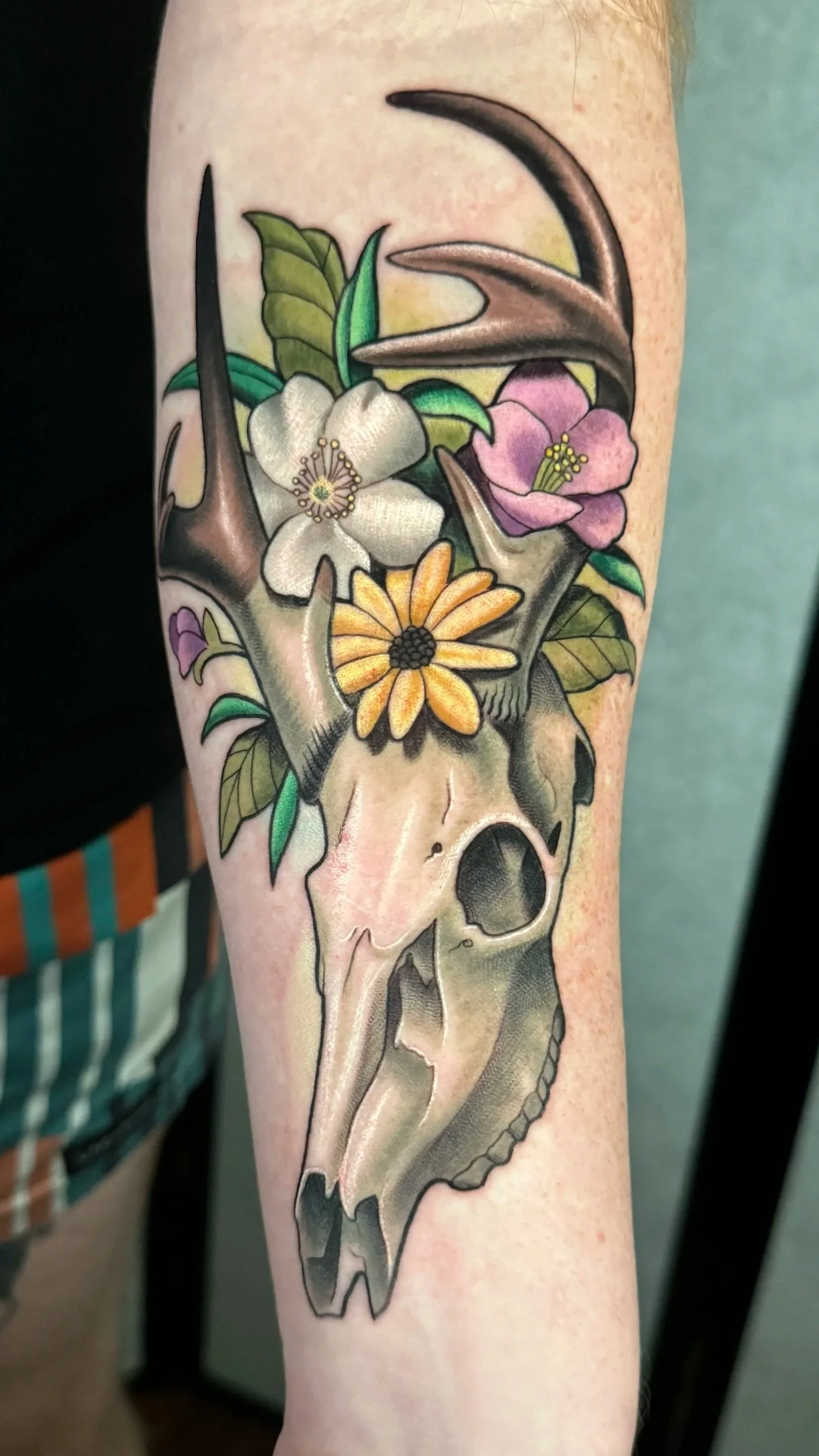 deer skull and flowers tattoo