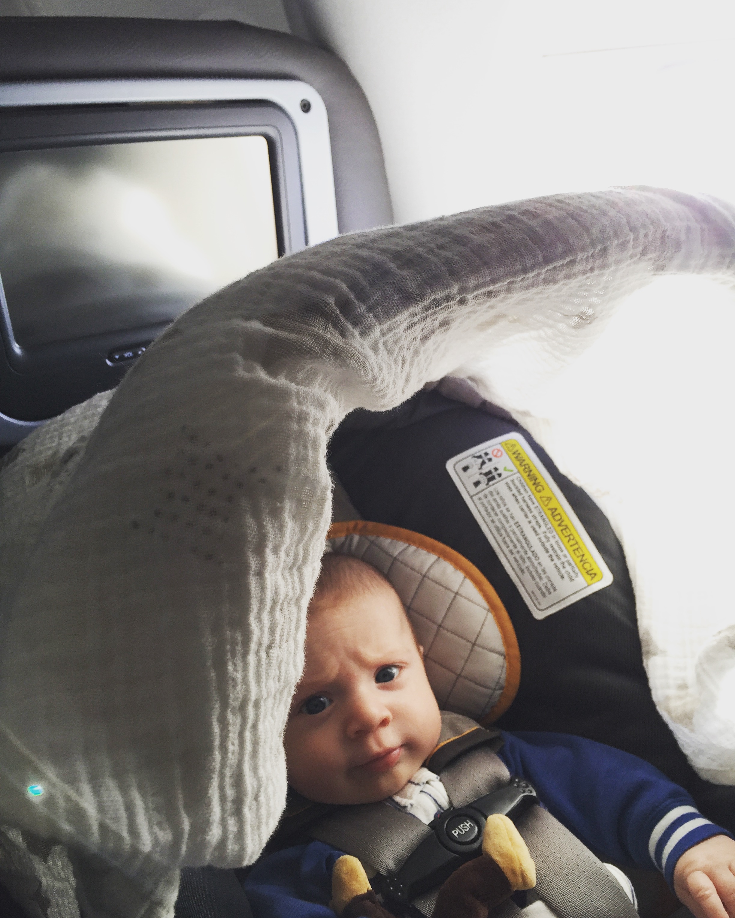 Miles's 1st plane ride - he handled international travel like a trooper!