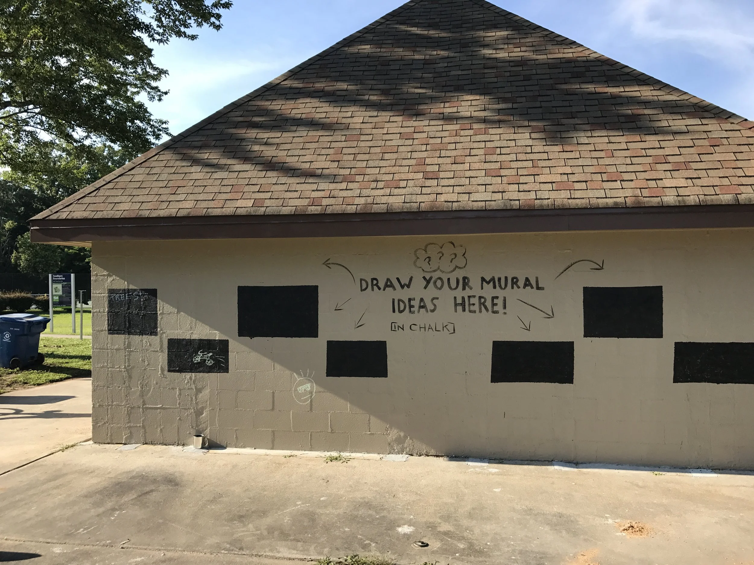 Request painted on the mural-site wall, inviting park-goes to chalk-in their ideas.