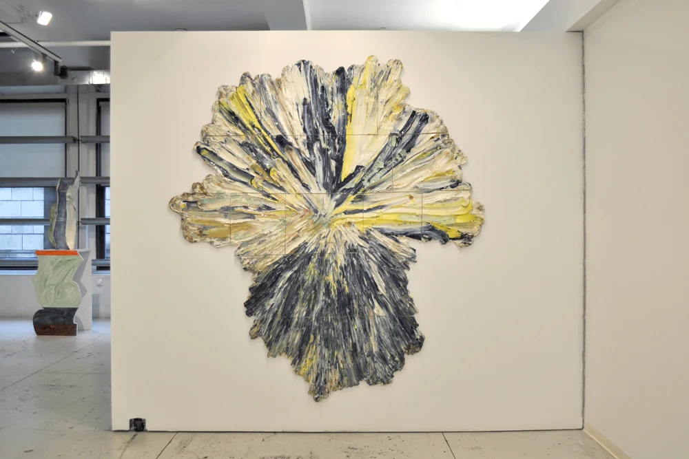 Brie Ruais, Unfolding (Liquid Color) , 2011, The artist's body weight in clay spread out in all directions; Stained blue, yellow, and green clay, white and brown stoneware, fired with clear glaze, 75 x 67 x 1 inches, Courtesy the artist and Nicole Klagsbrun, NY.