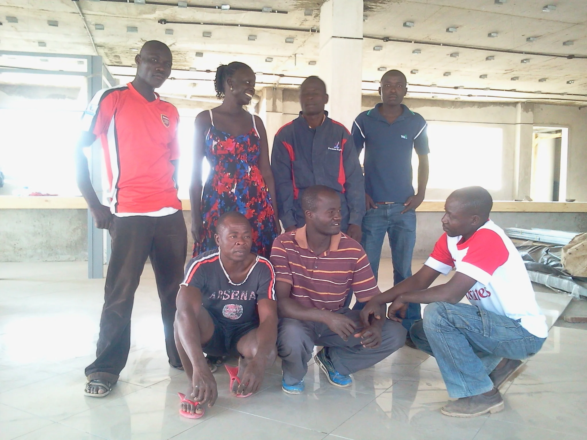 A group of friends in South Sudan celebrate America's independence day (July 4) by all dressing in red, white, and blue and drinking rum and Coca-Cola's.