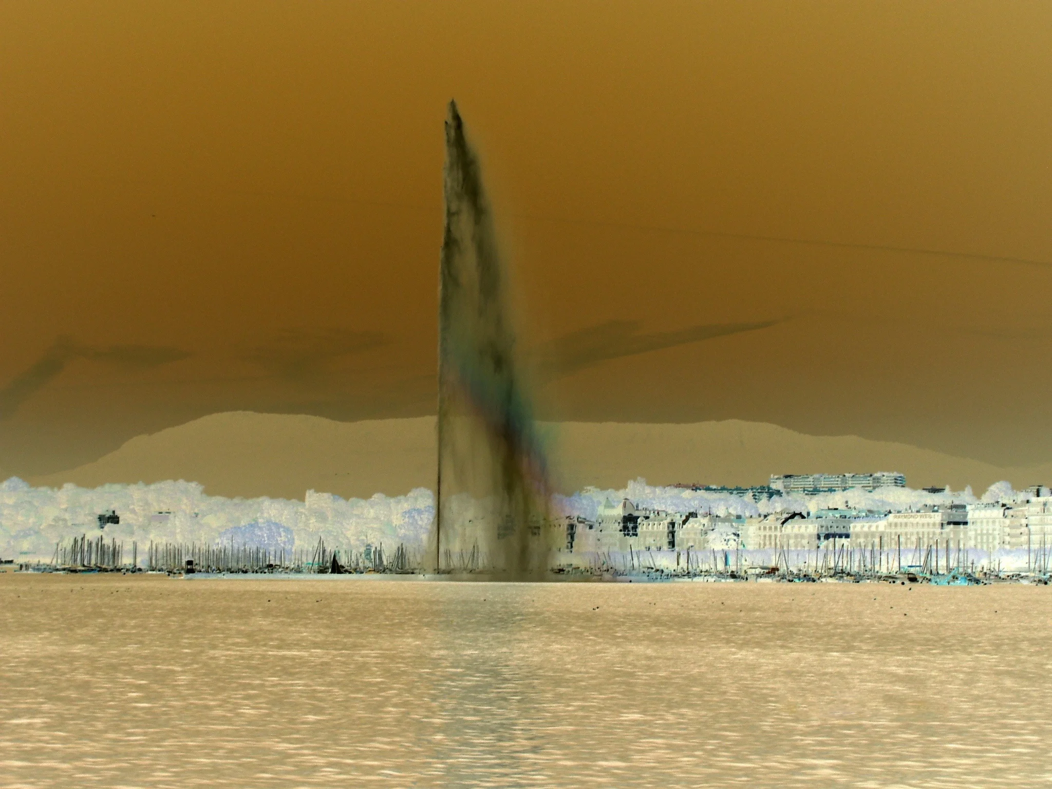 Tom Bogaert, a Beligian national artist living in Switzerland, creates a memorial for the Iraqi people on Iraq's independence day (Oct 3) by inverting the colors of Geneva's famous fountain to resemble an oil geyser in the Iraqi desert.