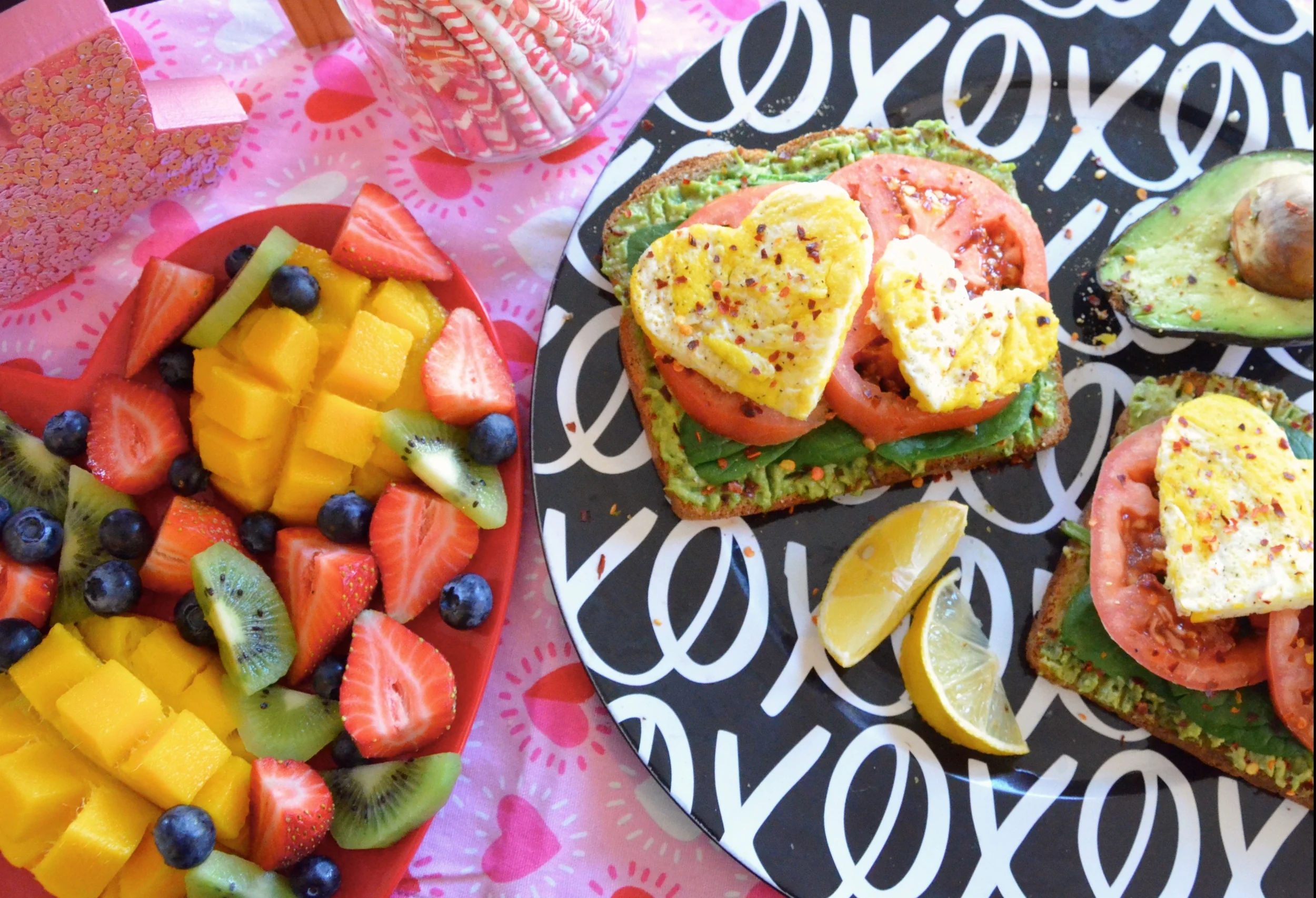 Avocado, Spinach, Tomato and Egg Breakfast Sandwiches with a Colorful Fruit Platter
