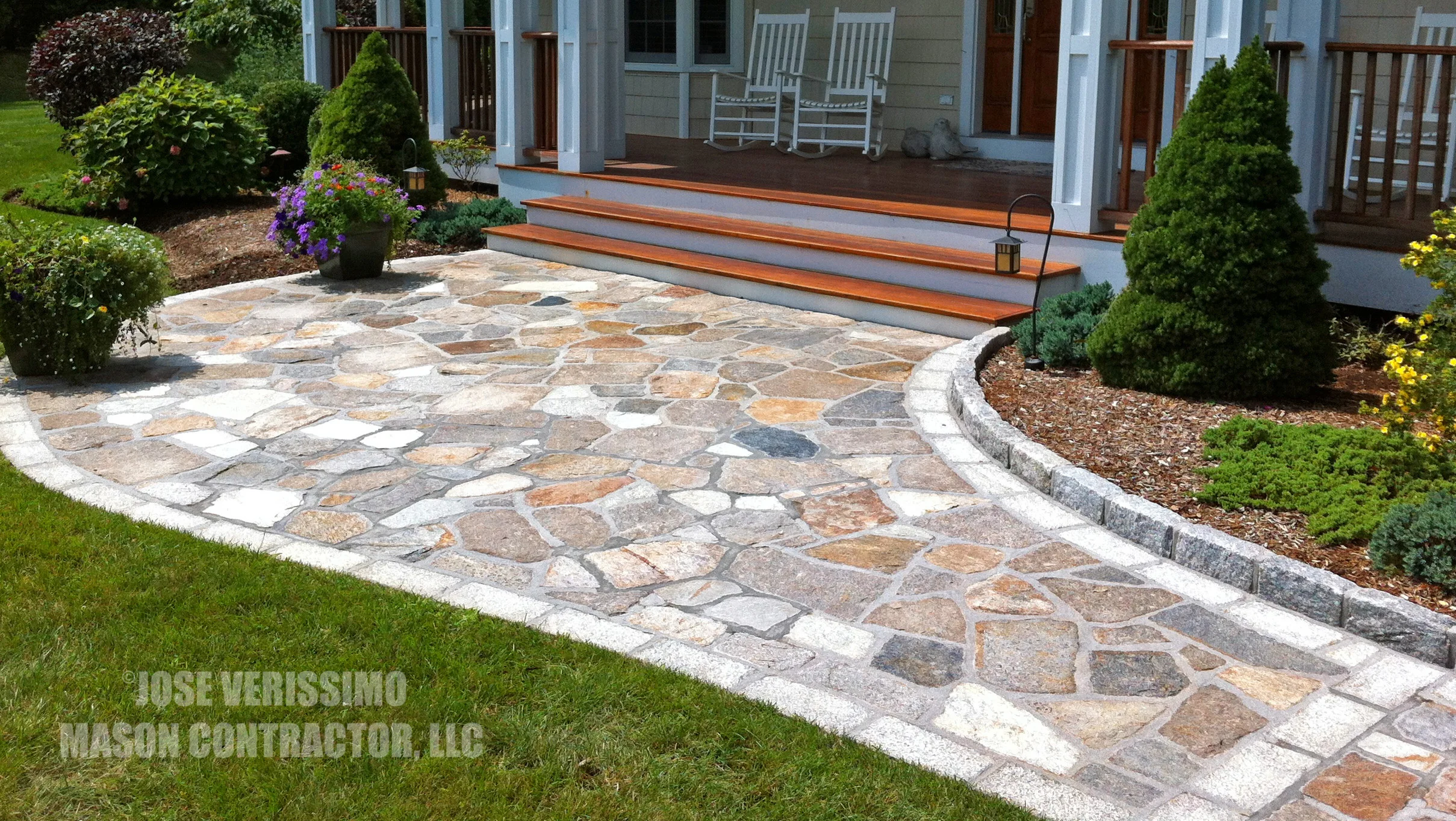 Natural Stone Patio With Cobble Stone Border
