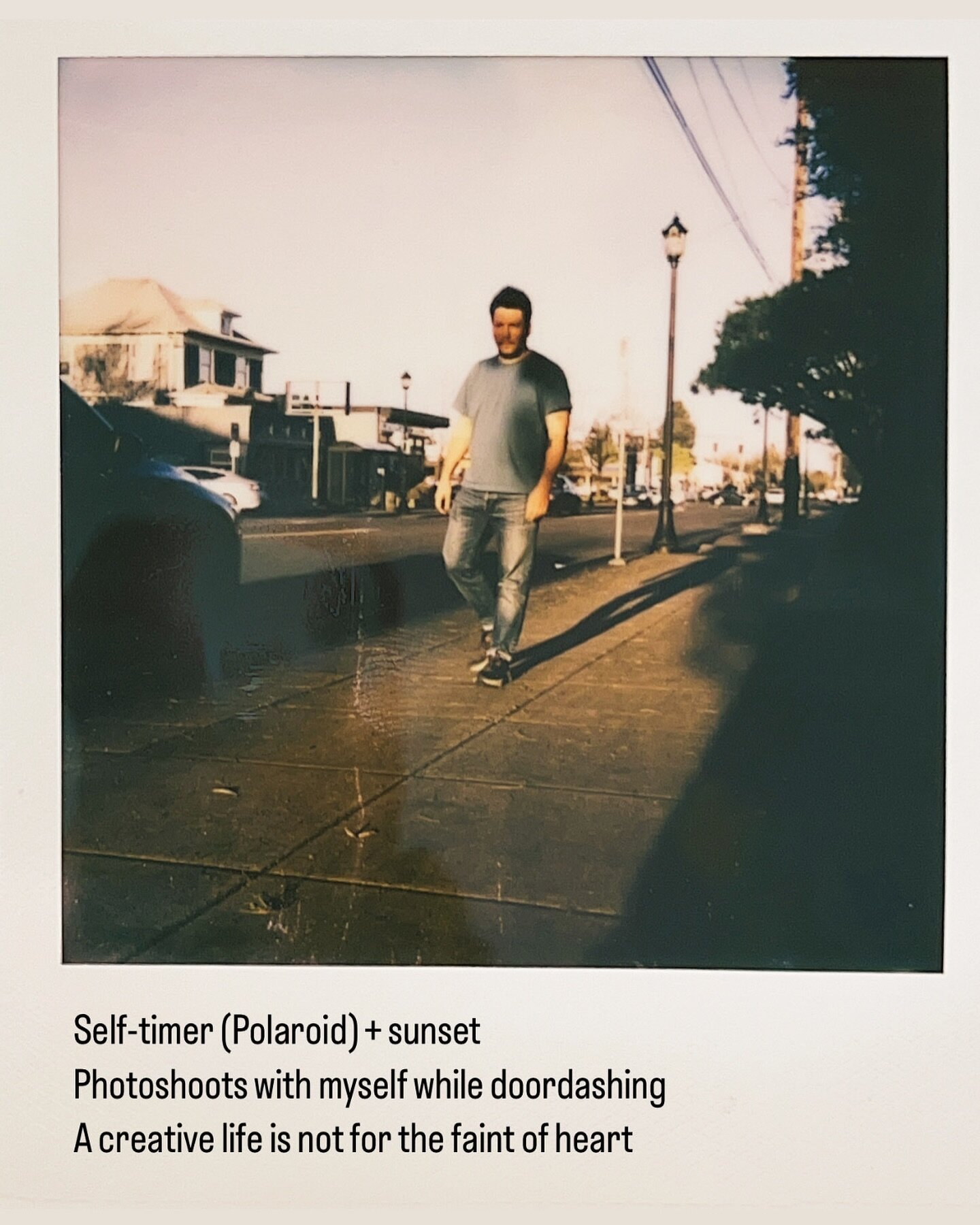 Text on Polaroid reads:

Self-timer (Polaroid) + sunset 
Photoshoots with myself while doordashing 
A creative life is not for the faint of heart 

#transmasculine #transmasc #transguy #sunset #polaroid #doordash #transgender #queer #lgbt #photograph