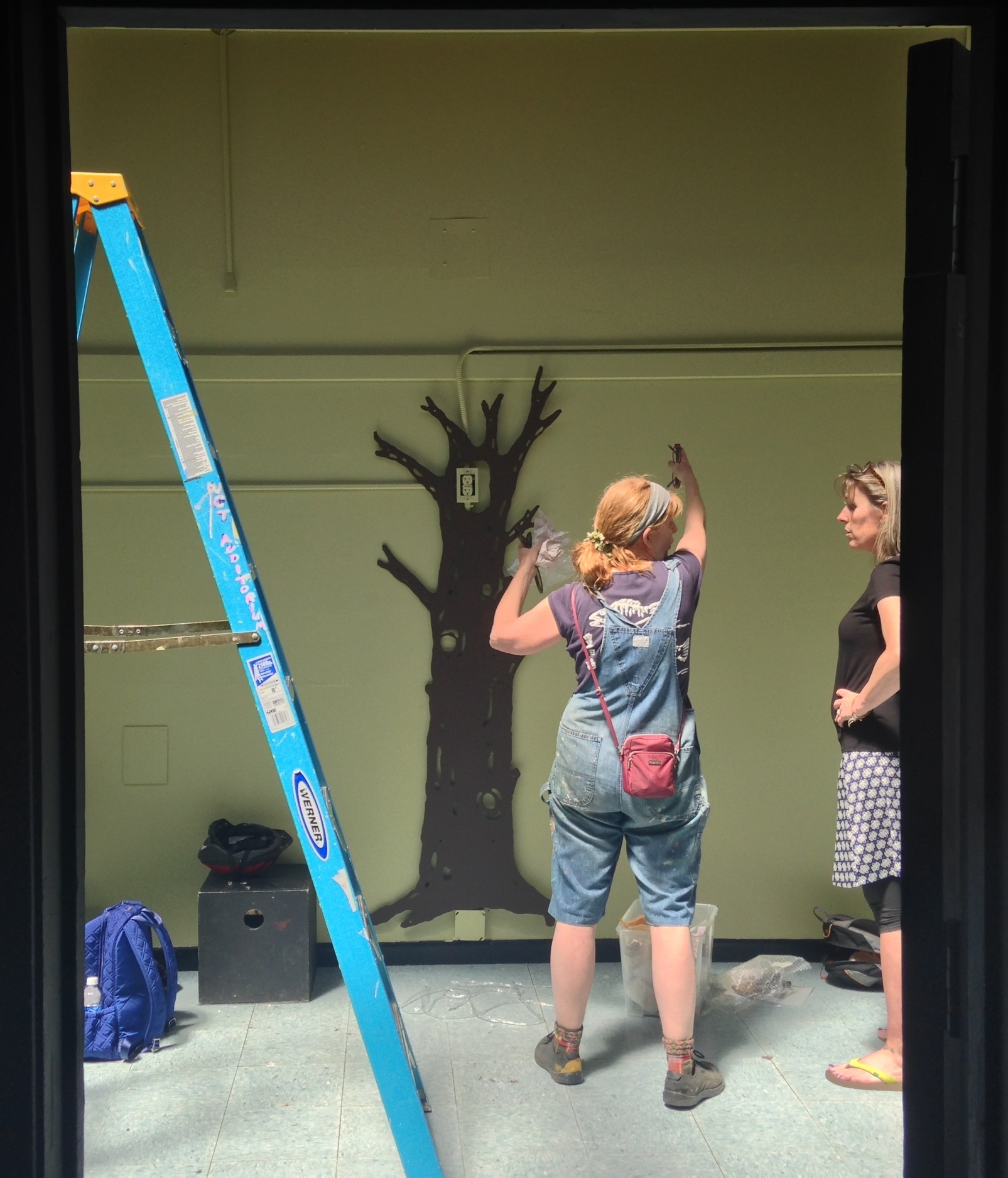 Melissa Koch and WCT Executive Director, Cait Cassée installing the Giving Tree
