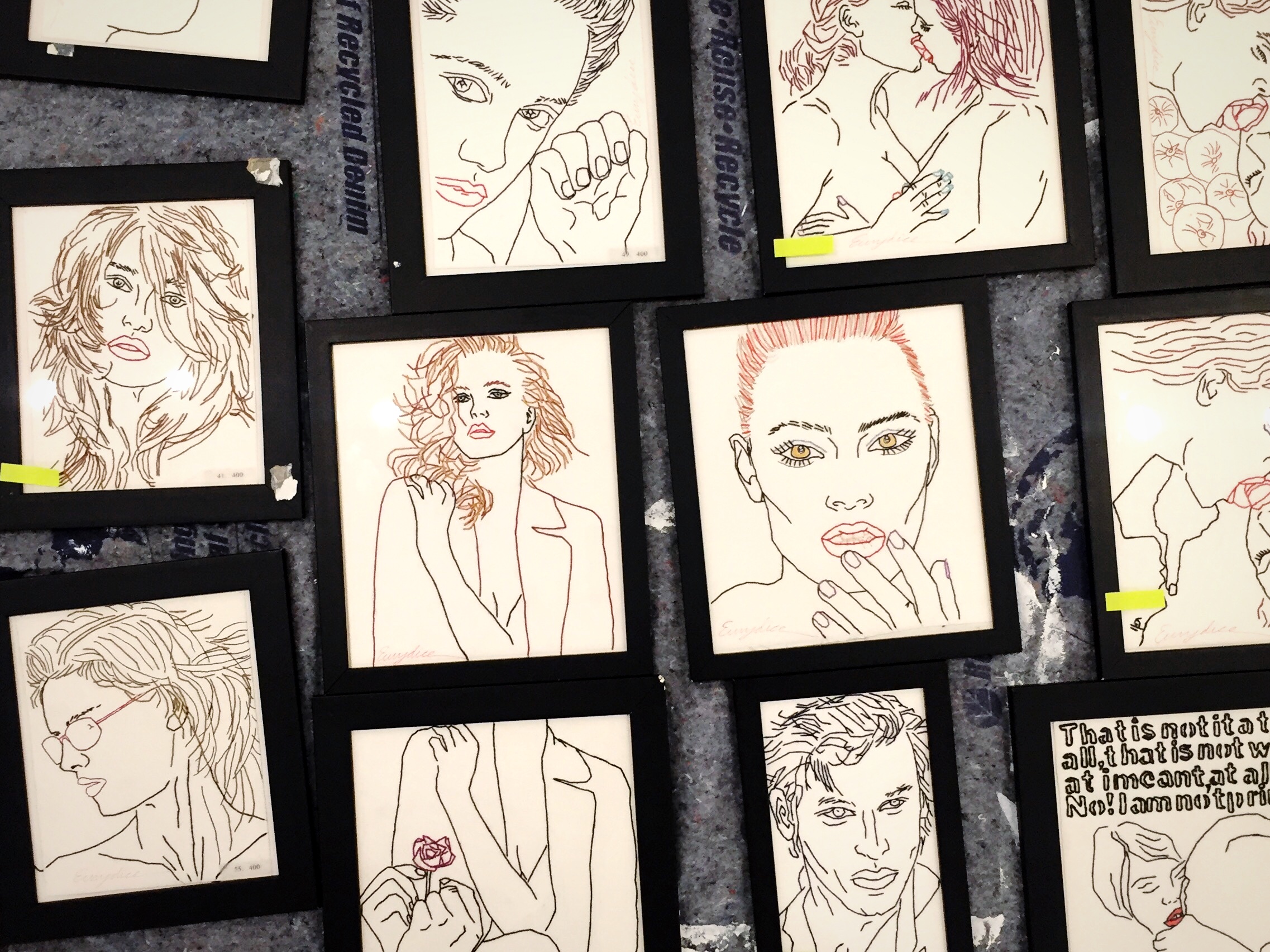 During installation, pieces are categorized and prepared to be hung. 