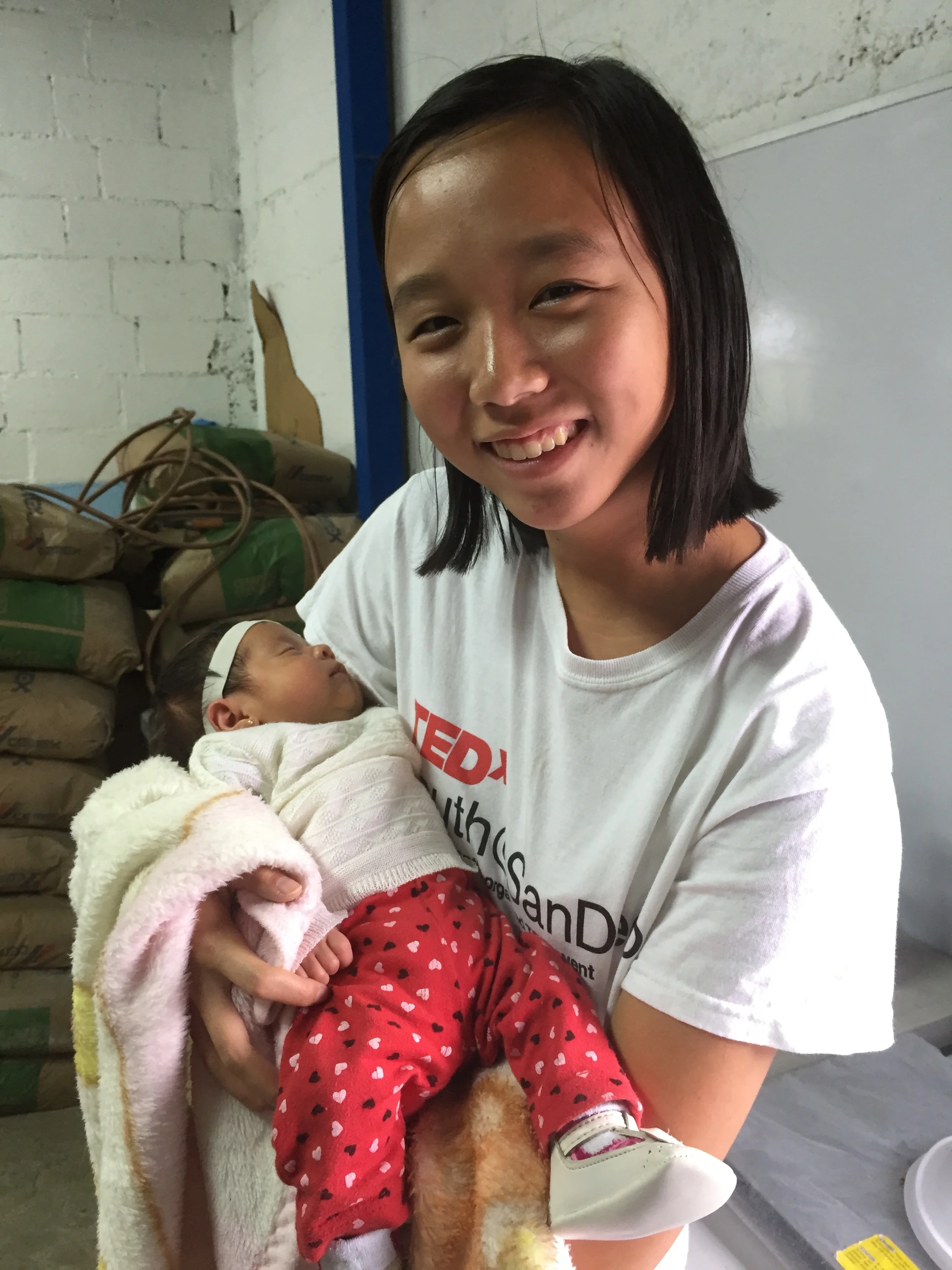 Karina holding a baby 