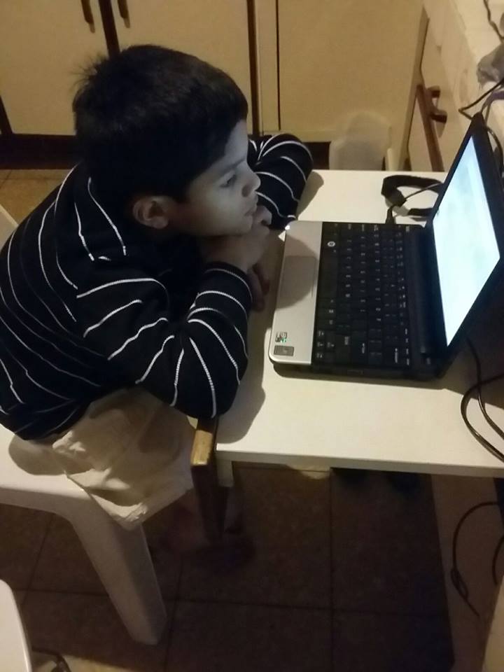 Julio working on the computer