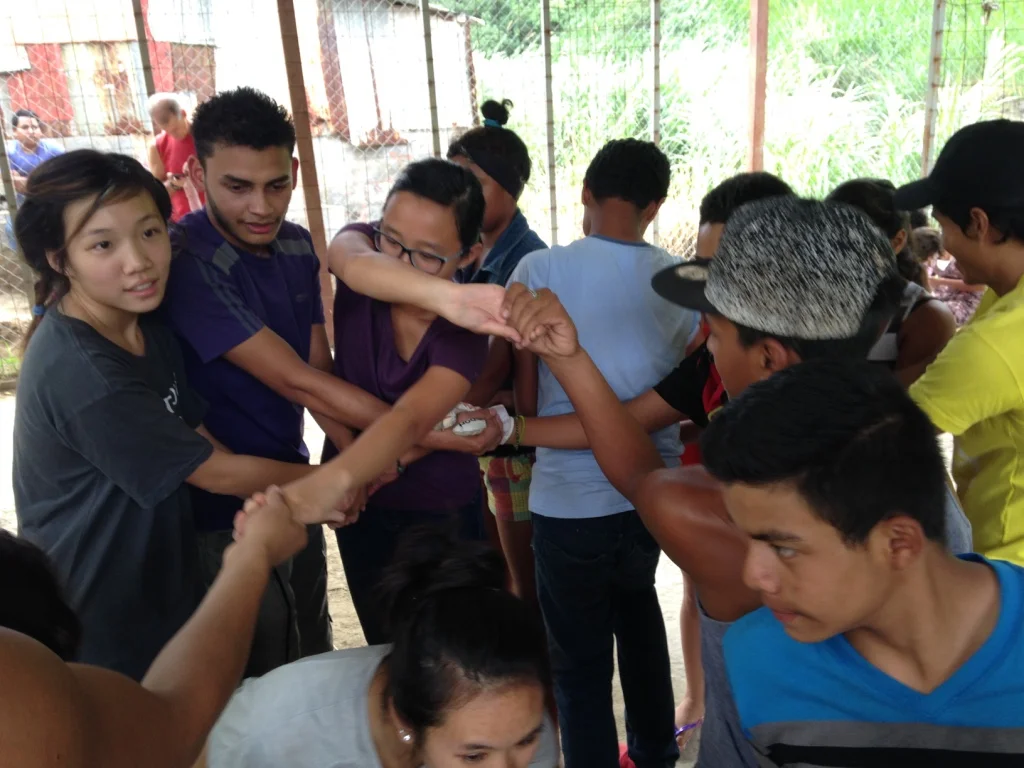 Playing a game with the La Carpio teenagers
