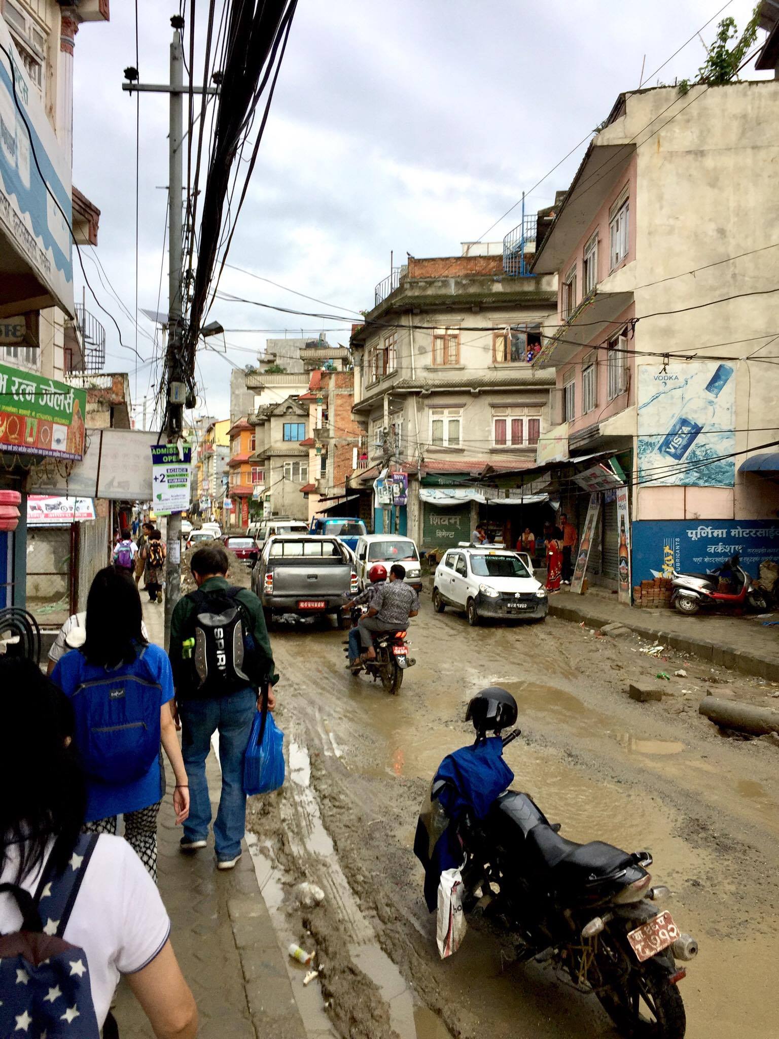 Our team would flyer and go shopping for groceries on these streets. Notice the dirt roads and the big potholes. Sometimes there were no sidewalks and it makes it difficult. 