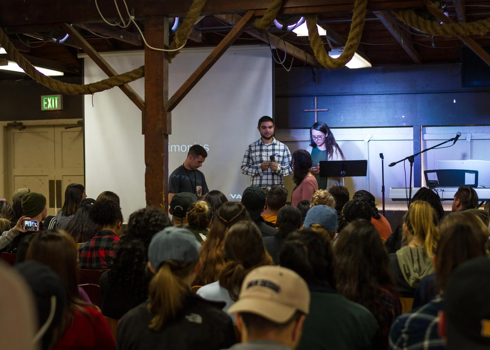 A picture of Abby (name changed for privacy) receiving prayer before sharing how she came to faith at Fall Conference!