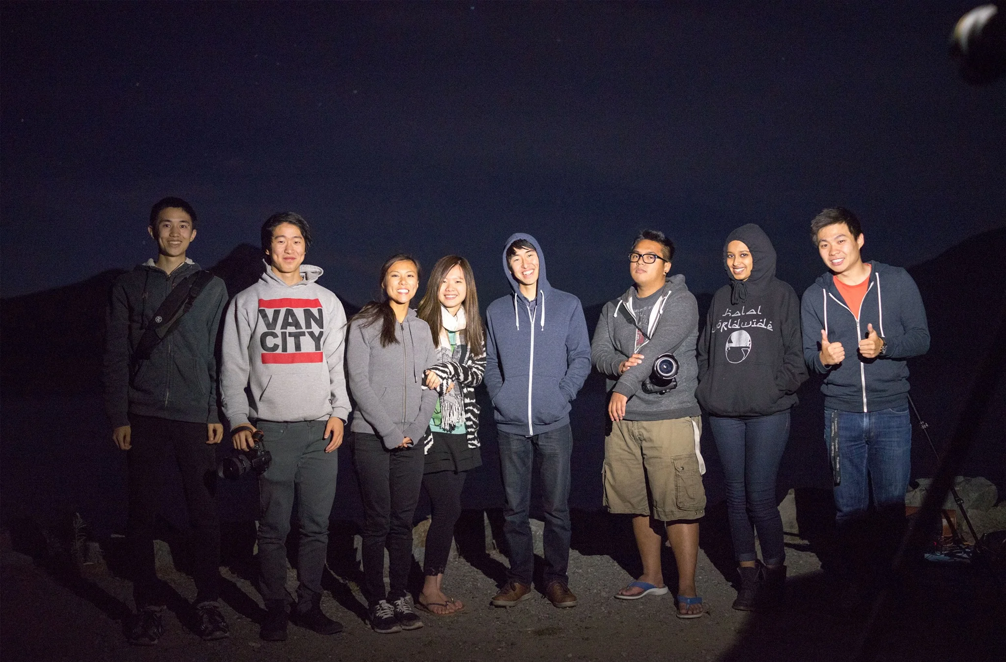 A group photo we took together before leaving. This was lit using a phone's flashlight carefully balanced on the hot shoe of the DSLR just on the upper right corner of the frame.