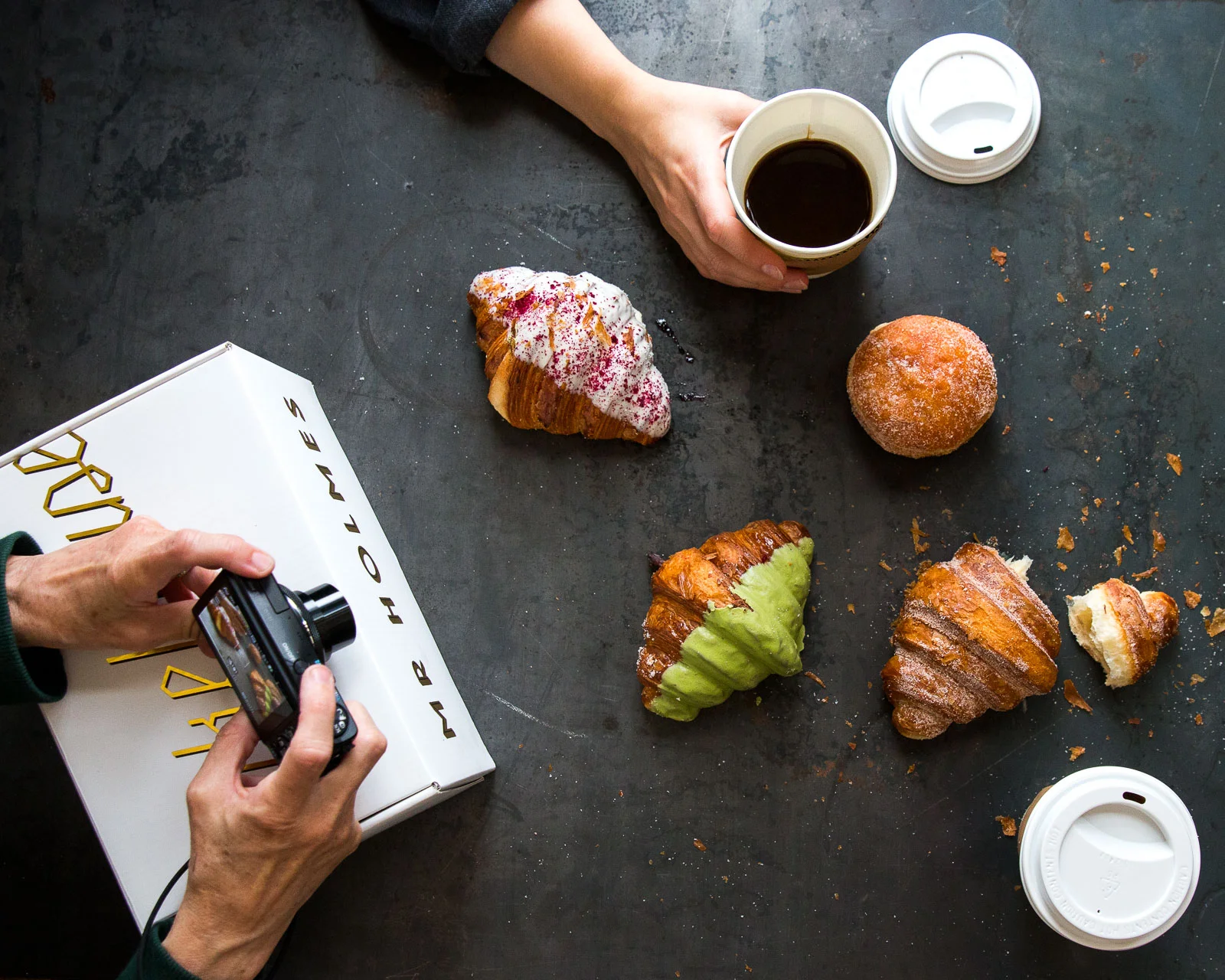 Above: Our first impromptu food styling / food photography shoot featuring Mr. Holmes Bakehouse pastries brought by Julianna . Below: Alex and Sylvie compose the perfect top down shot of Mr. Holmes Bakehouse pastries. / Ellie very patiently adding a human element into the scene.