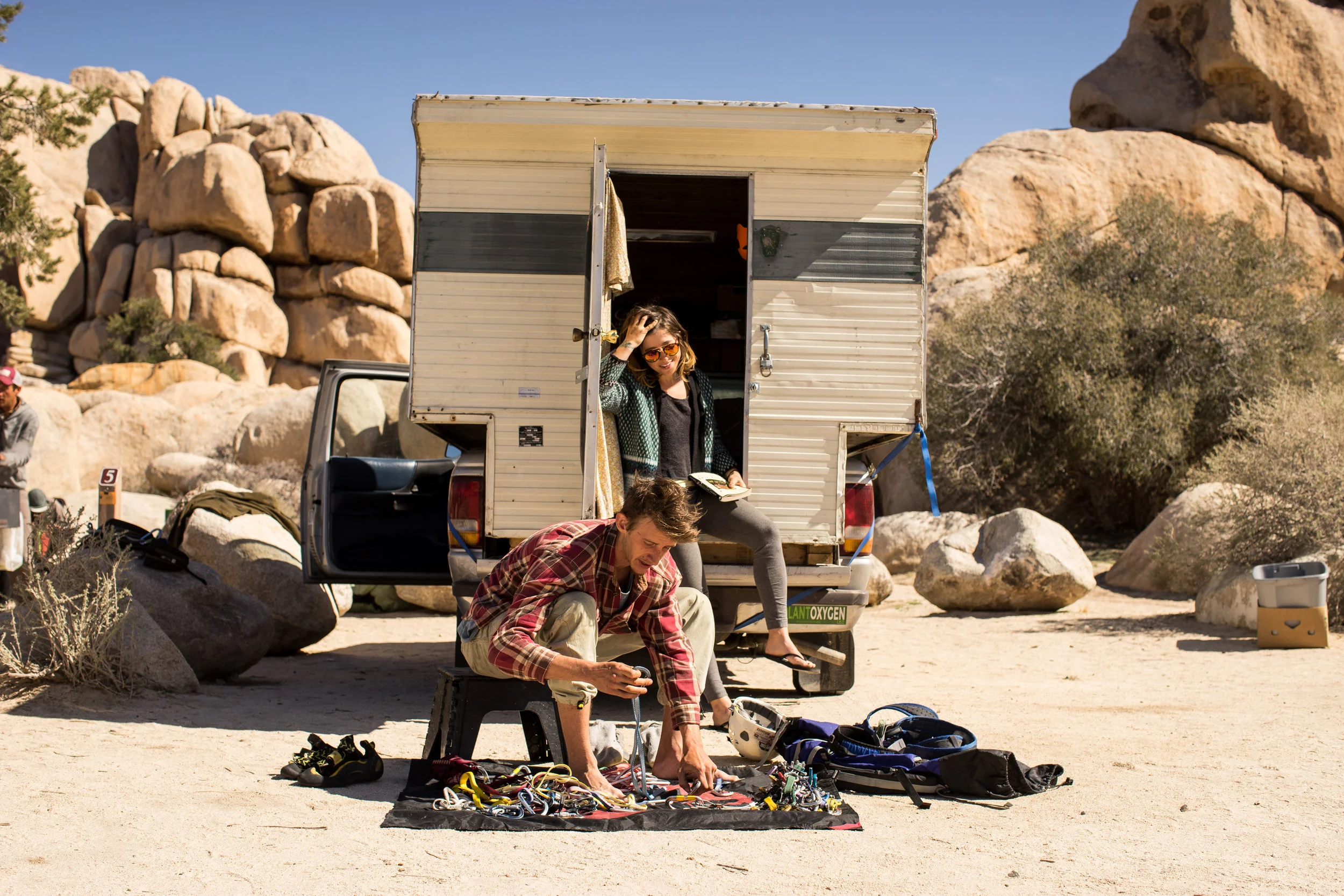 Mike, 25, and Emma, 21, live together in their truck. Mike organizes the gear while Emma determines the day's routes. Both are currently unemployed, and have been traveling for months. They sell fresh vegetables when they can, and often cook big meals for the climbers in Camp #5.