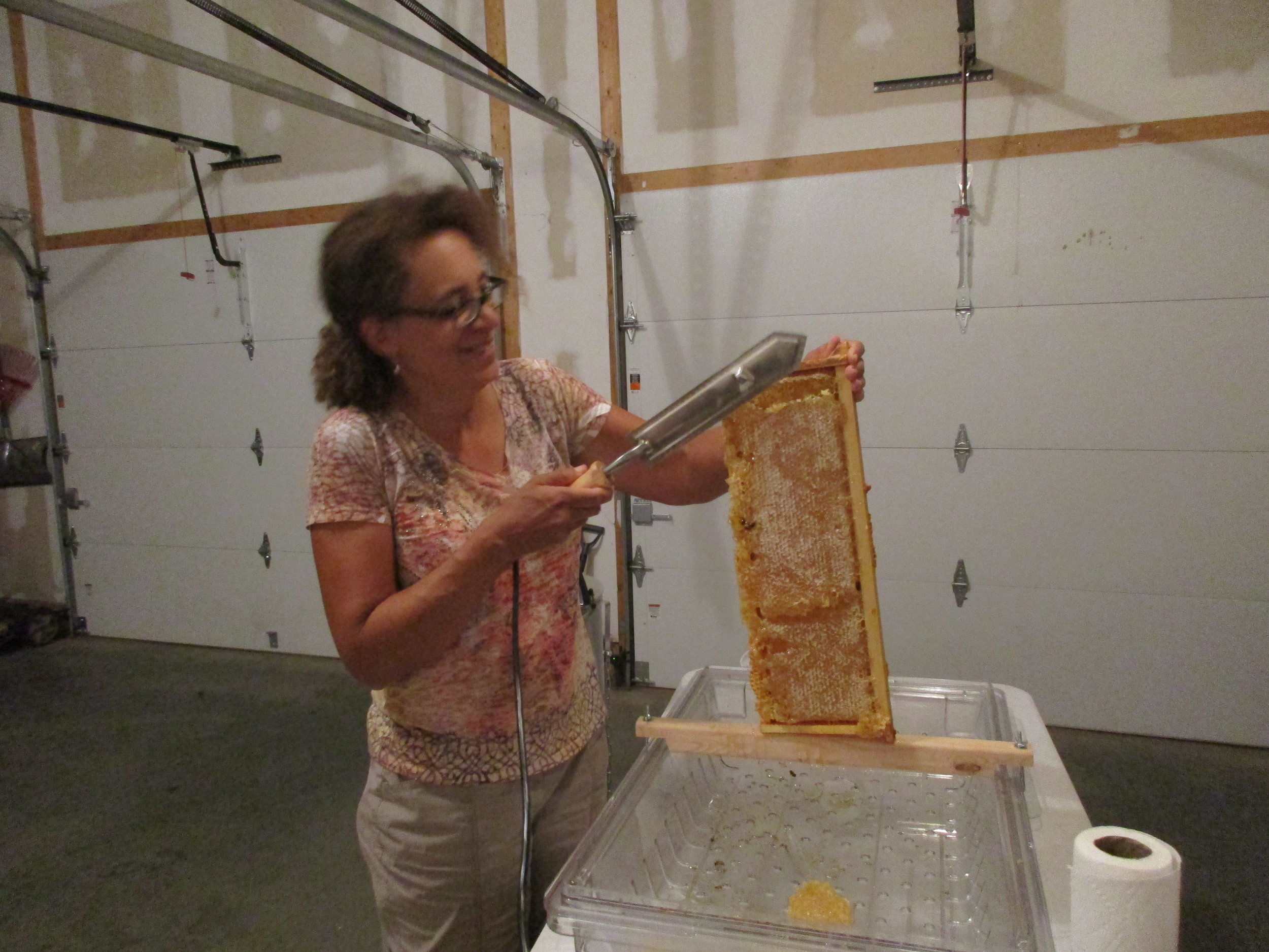 I get to do the first slicing off of wax cappings.