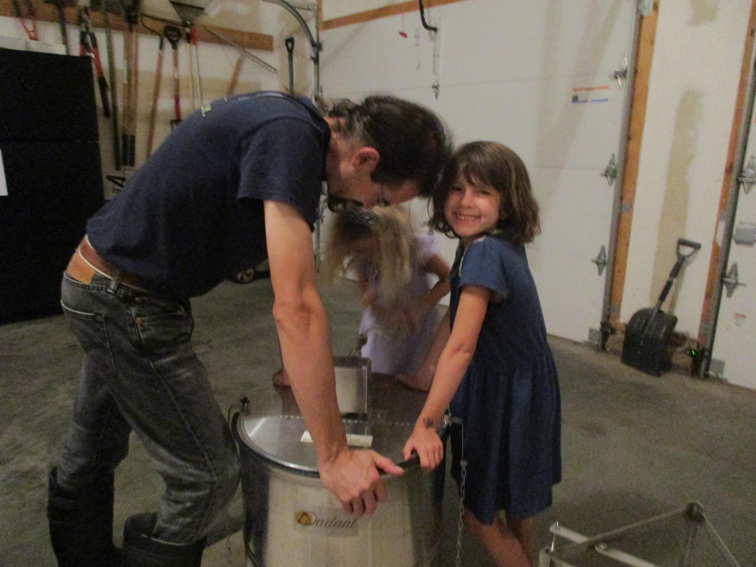 Alex is cranking the handle, Norman and Desta are holding it down.
