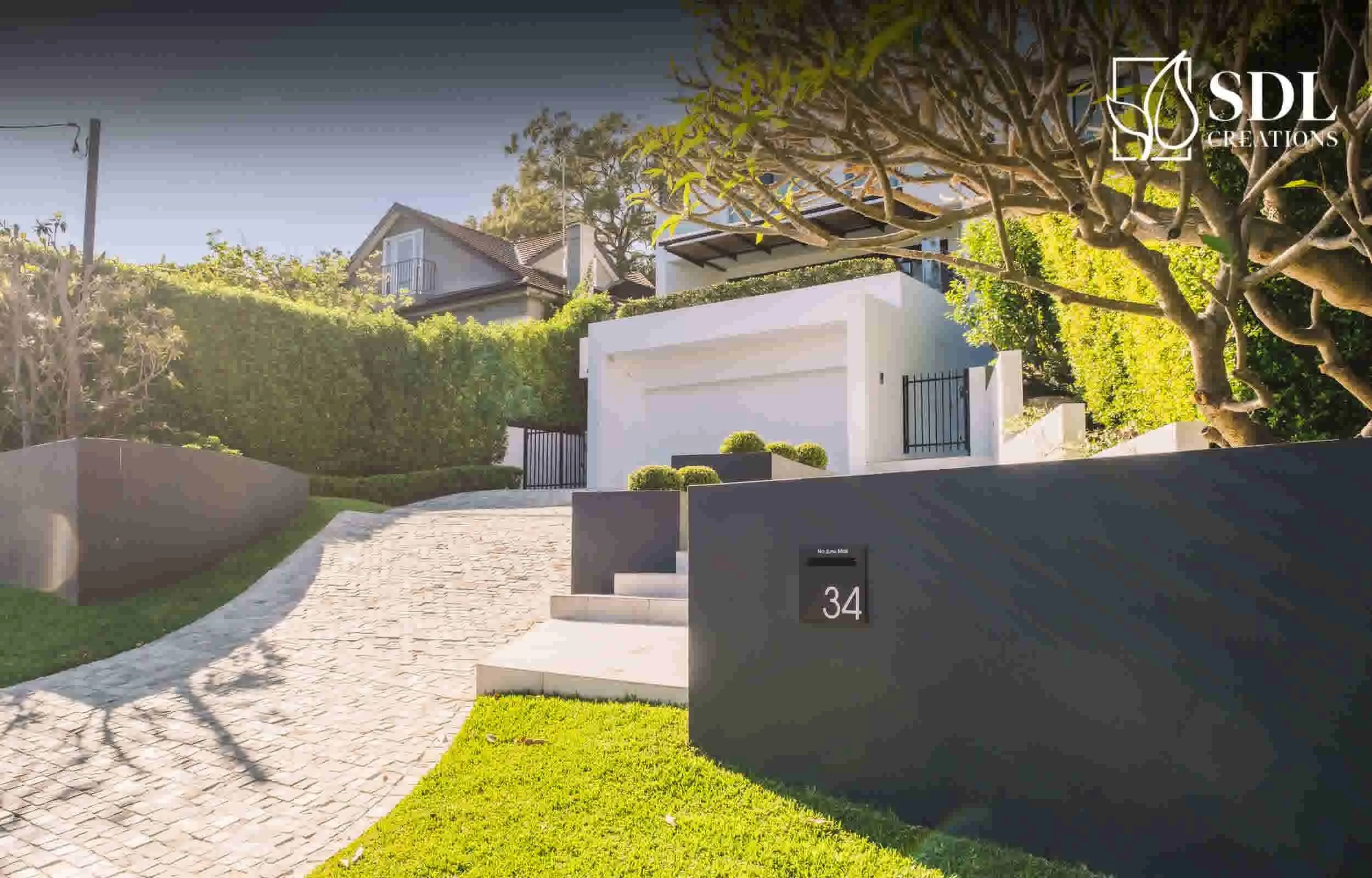 Retaining wall creating level garden space on uneven terrain