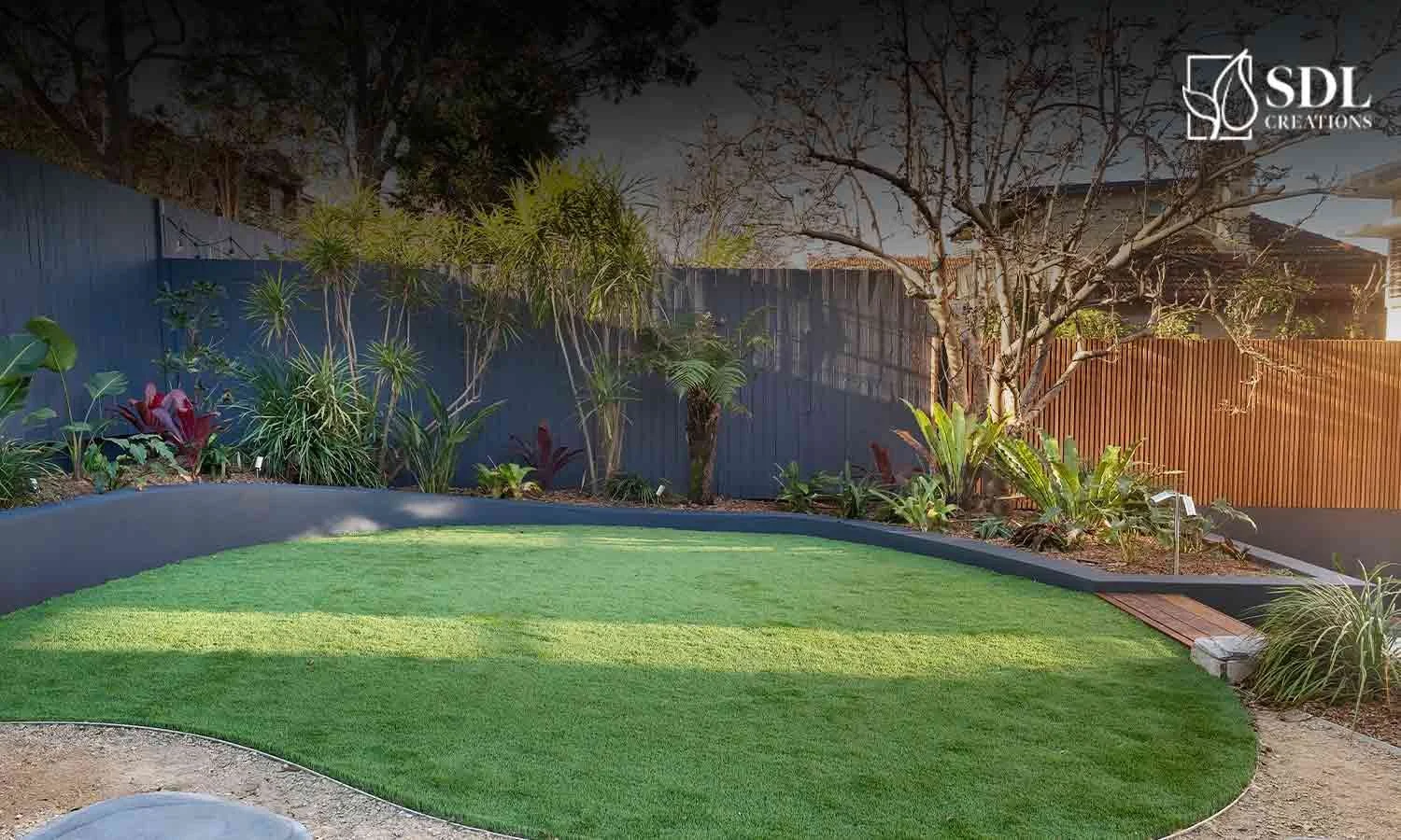 Retaining wall preventing soil erosion on a steep sloped property