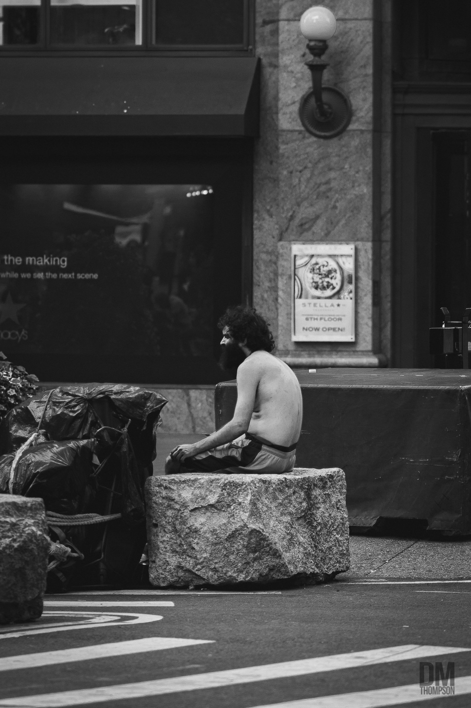 SilentNY-HearldSQ-Sittingrock-Man.jpg
