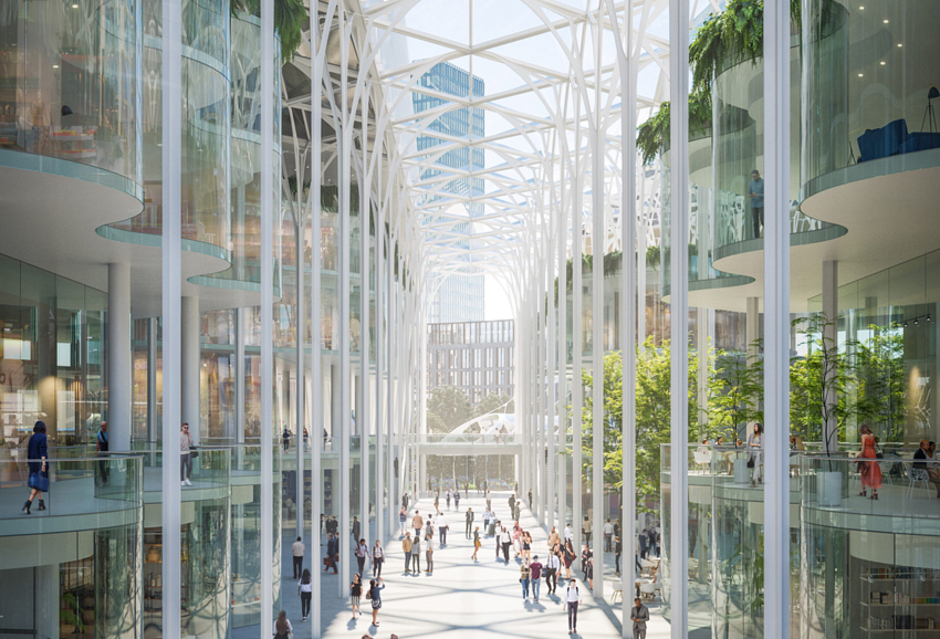 "A 500ft long galleria features a repetitive arboreal structure; slender columns form an 'avenue of trees', their detailed branch-like crowns connecting to support the glass canopy. This vaulting arcade creates a promenade of pavement cafes, shops and restaurants."