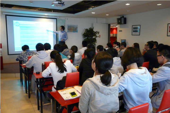 David Weeks teaching a debate concept to student in Chengdu