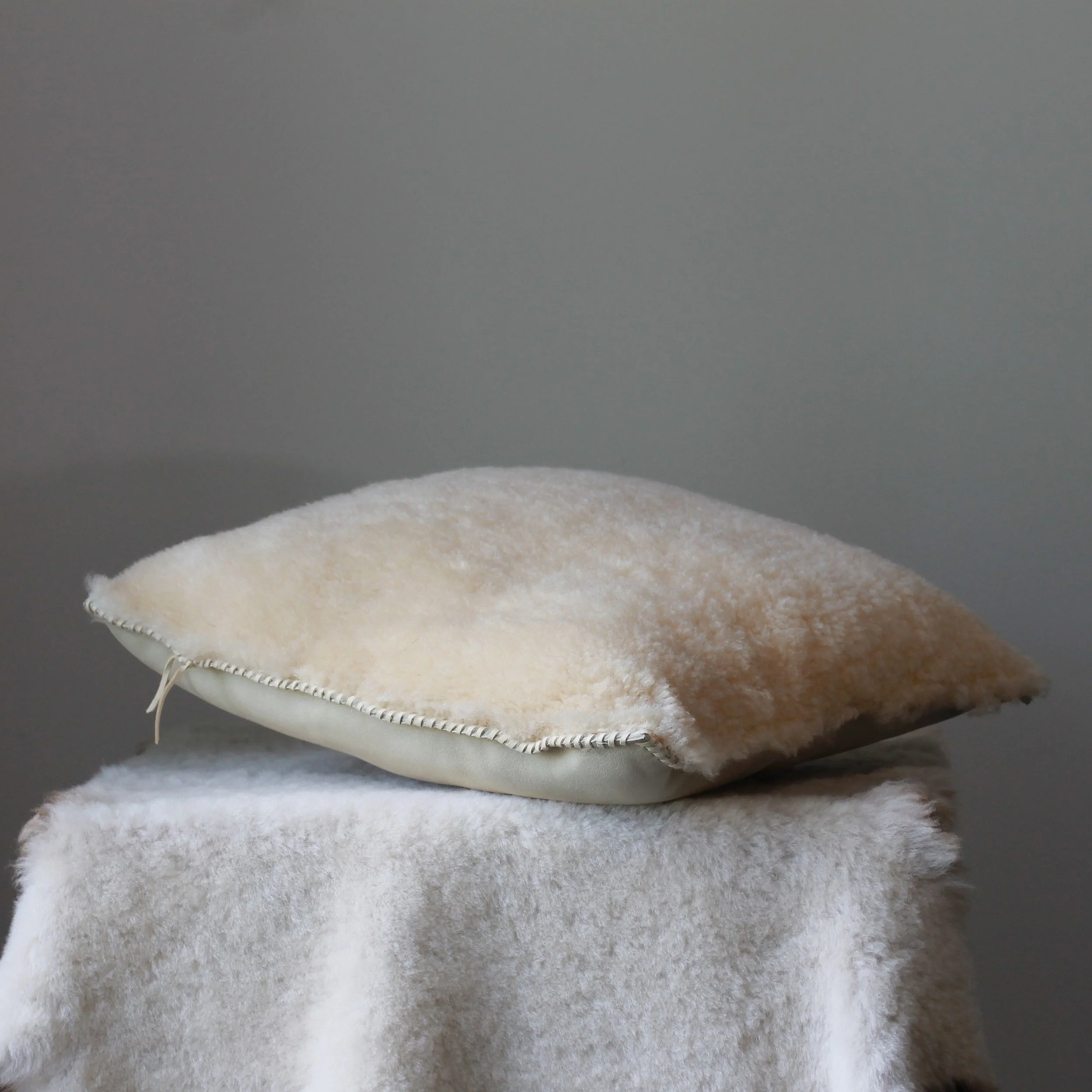 Ivory+Shearling+Pilllow+laying+down+1.jpg