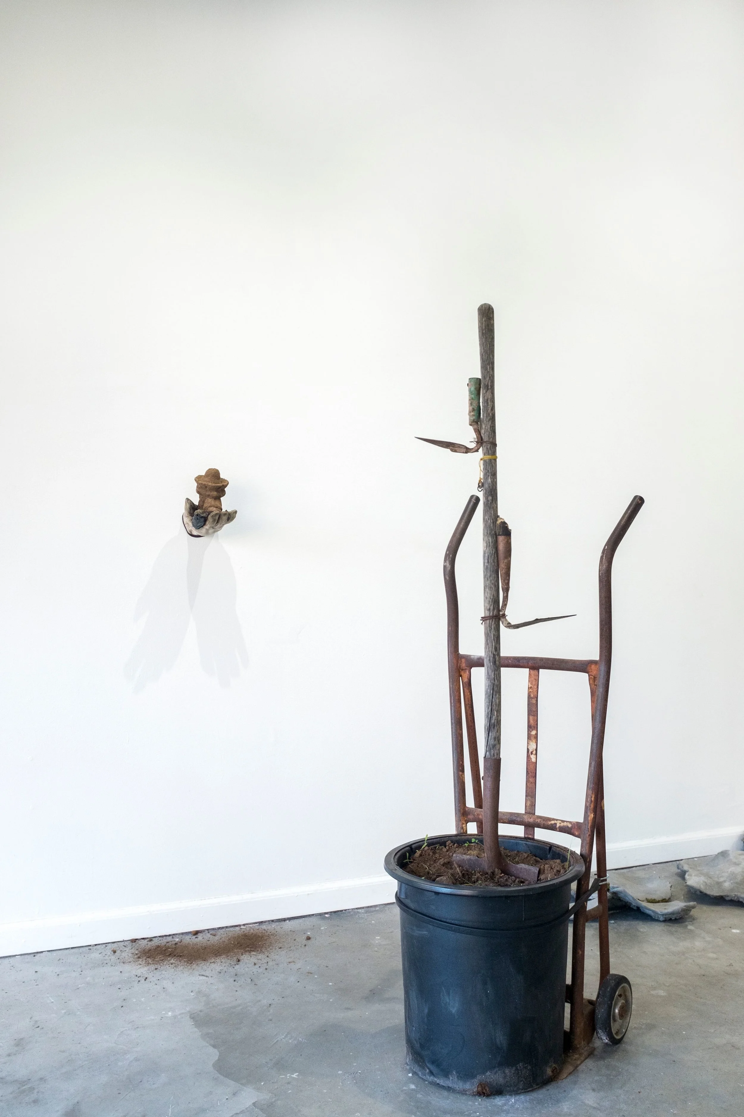 ofrenda (bird feeder) , 2019 Juan’s glove, father’s tools, soil from Southern California, bird seed photo credit: Savannah Wood
